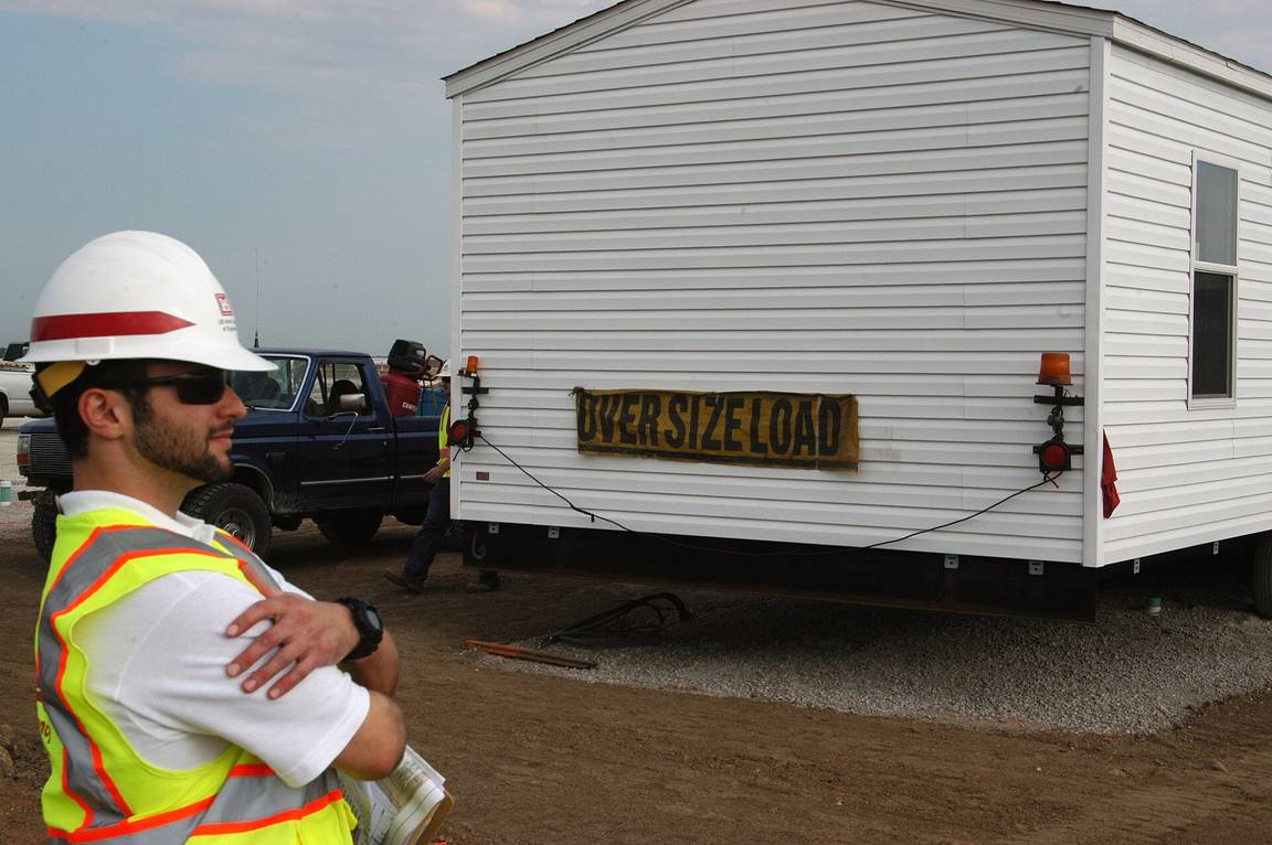 Factory-built modular homes arriving on trailers for installation in Joplin, Missouri
