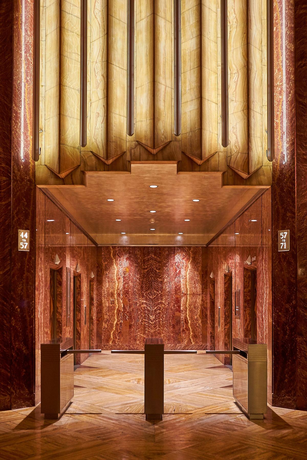 Chrysler Building elevator lobby in New York with book-matched onyx, red marble and wood marquetry