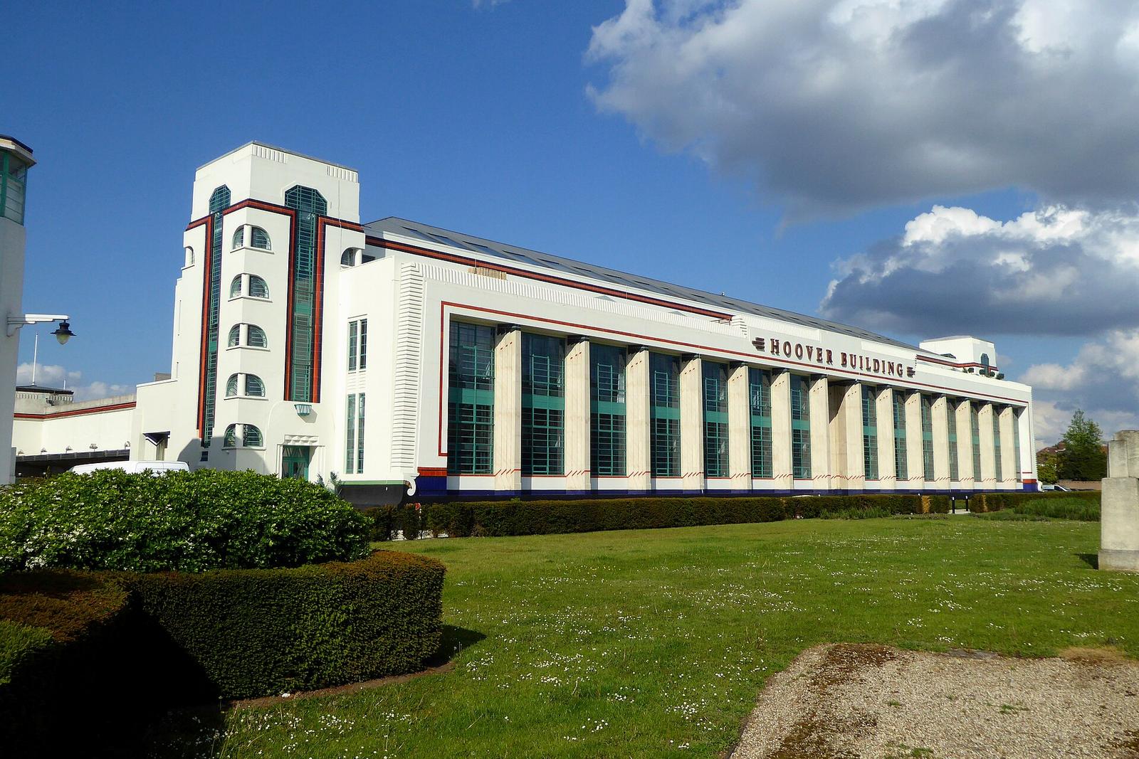 The Hoover Building in Perivale, London, a long white Art Deco factory facade with green glazing