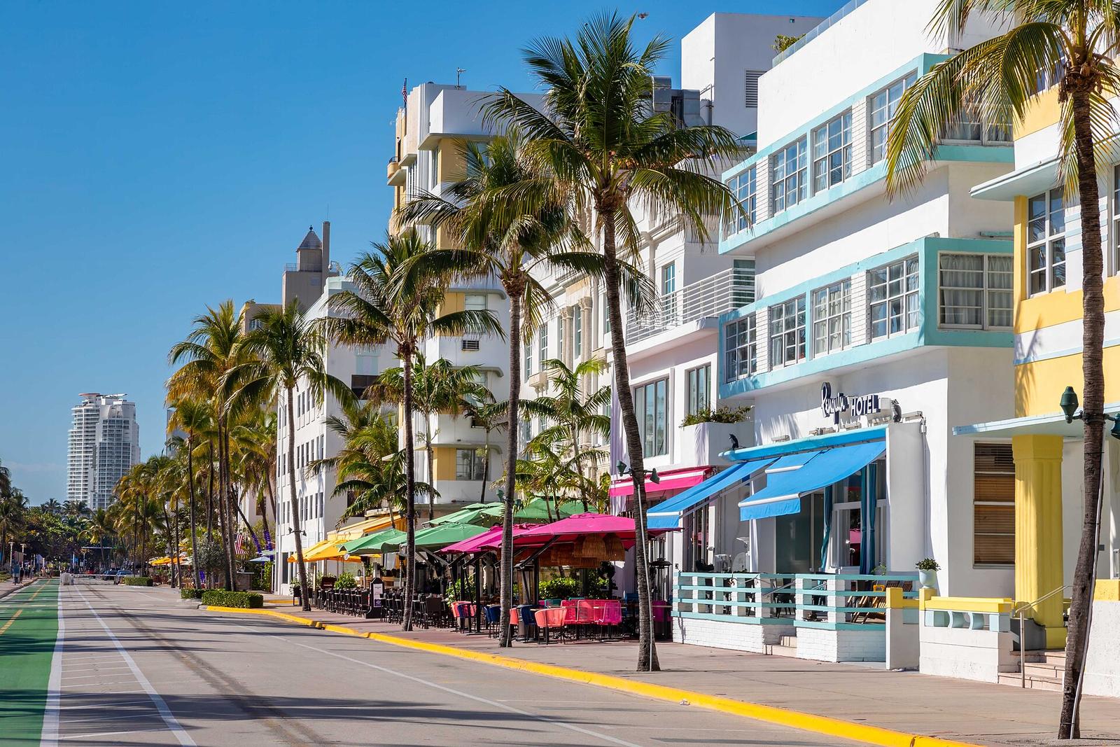 Pastel Art Deco hotels with palm trees along Ocean Drive in Miami Beach