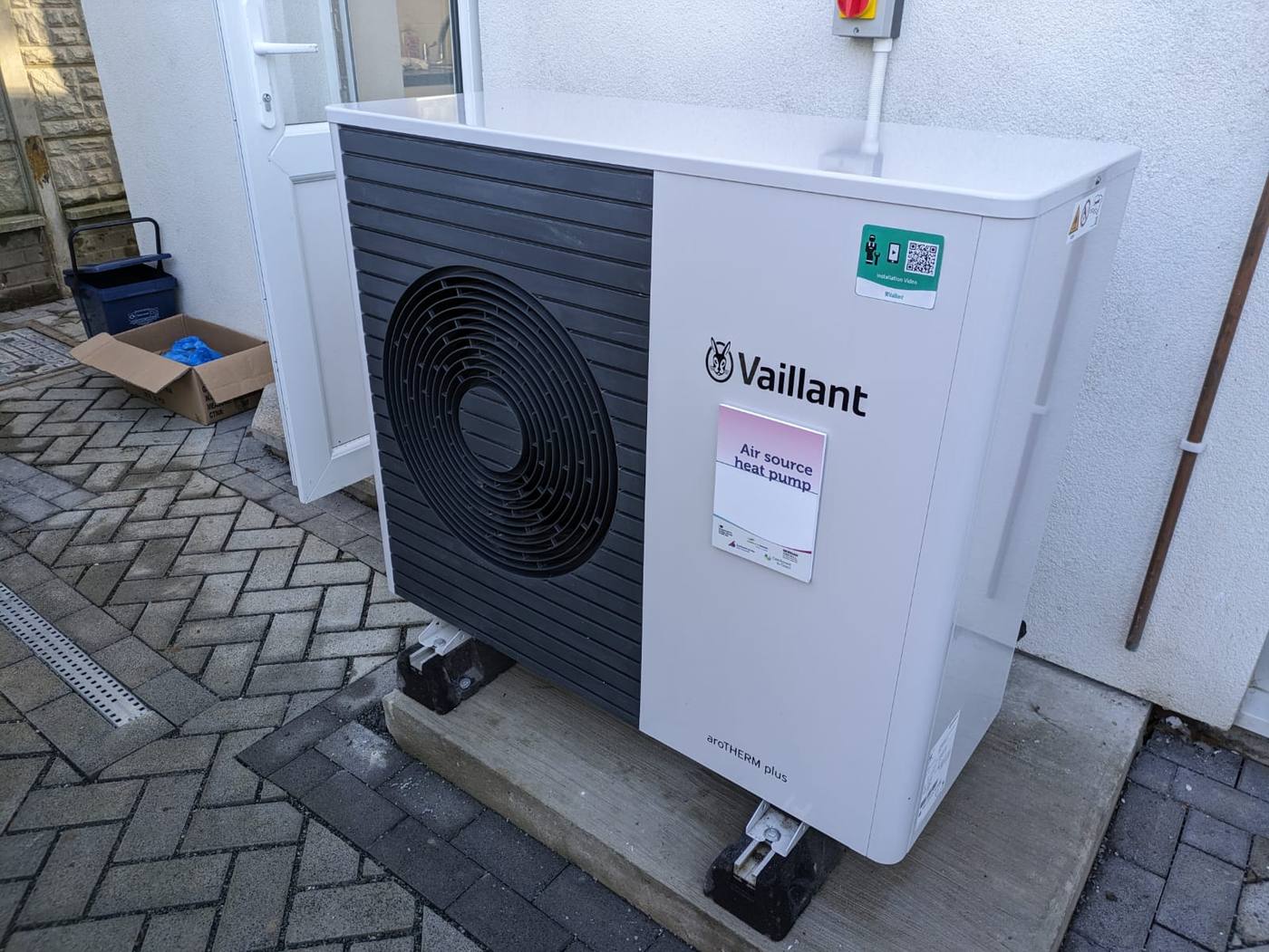 An air-source heat pump outdoor unit fitted to a terraced house in Southend, England