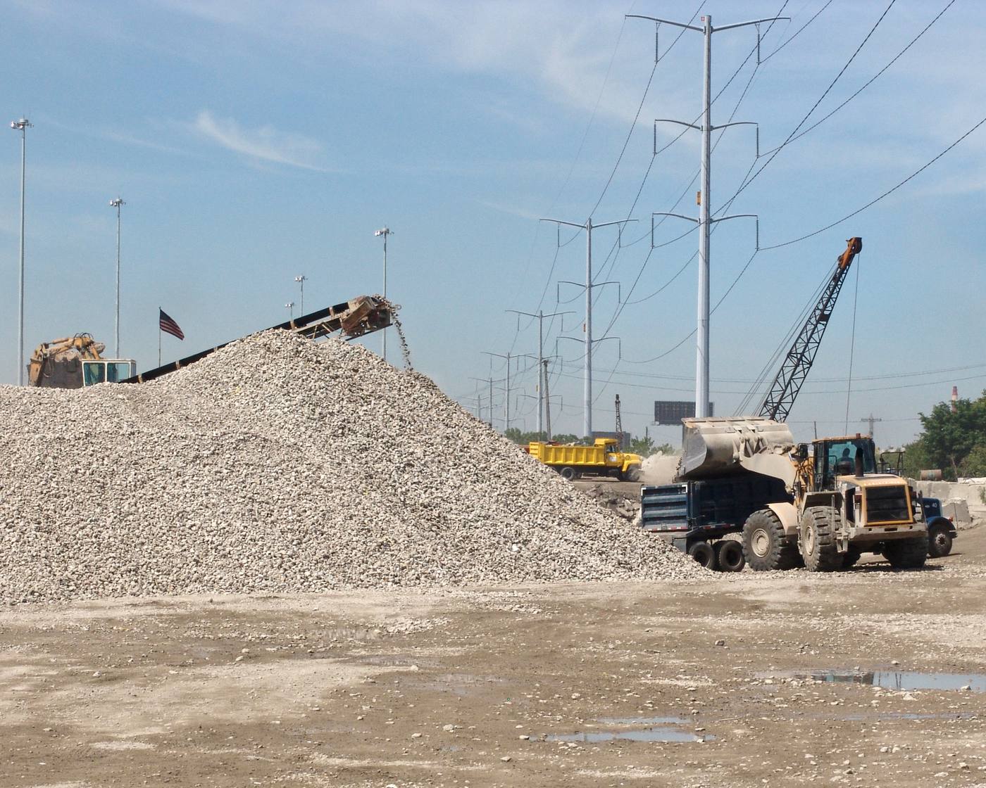 Crushed recycled concrete aggregate being loaded into a dump truck