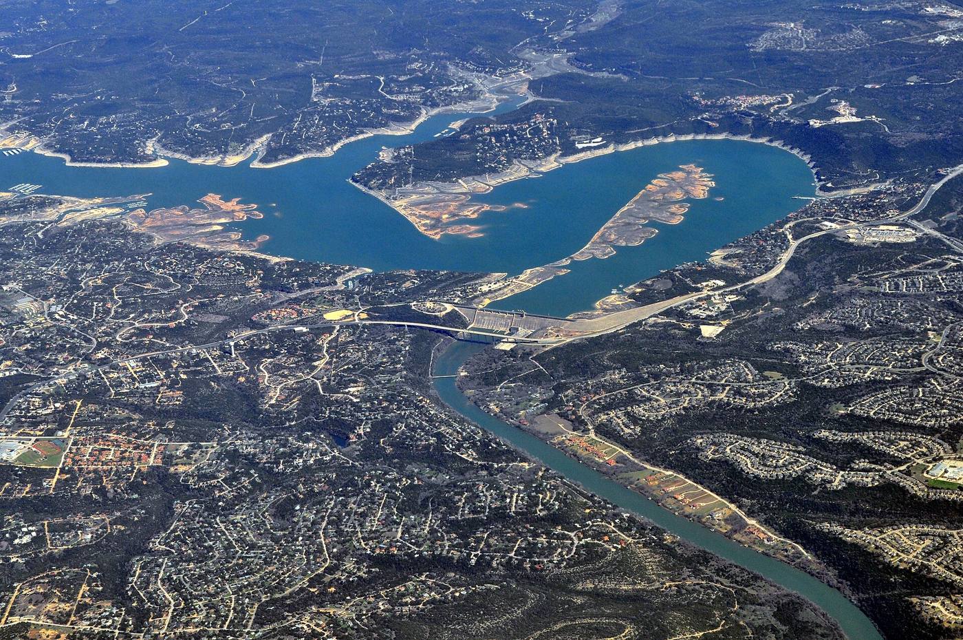 Aerial view of a hydroelectric dam and reservoir