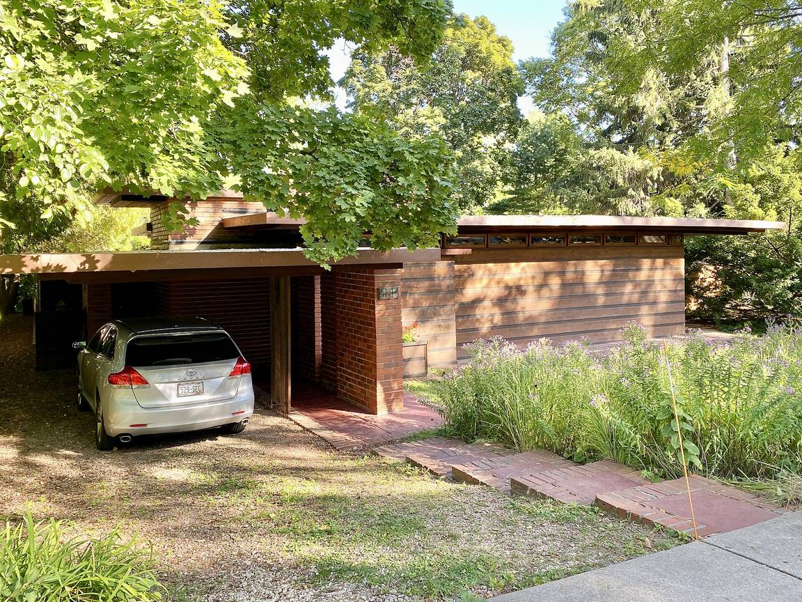 The Jacobs House in Madison, Wisconsin, a low brick Usonian house with a carport under a shallow roof