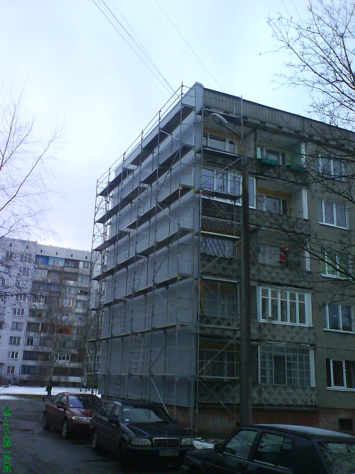Insulation work on the wall of an old building in Riga