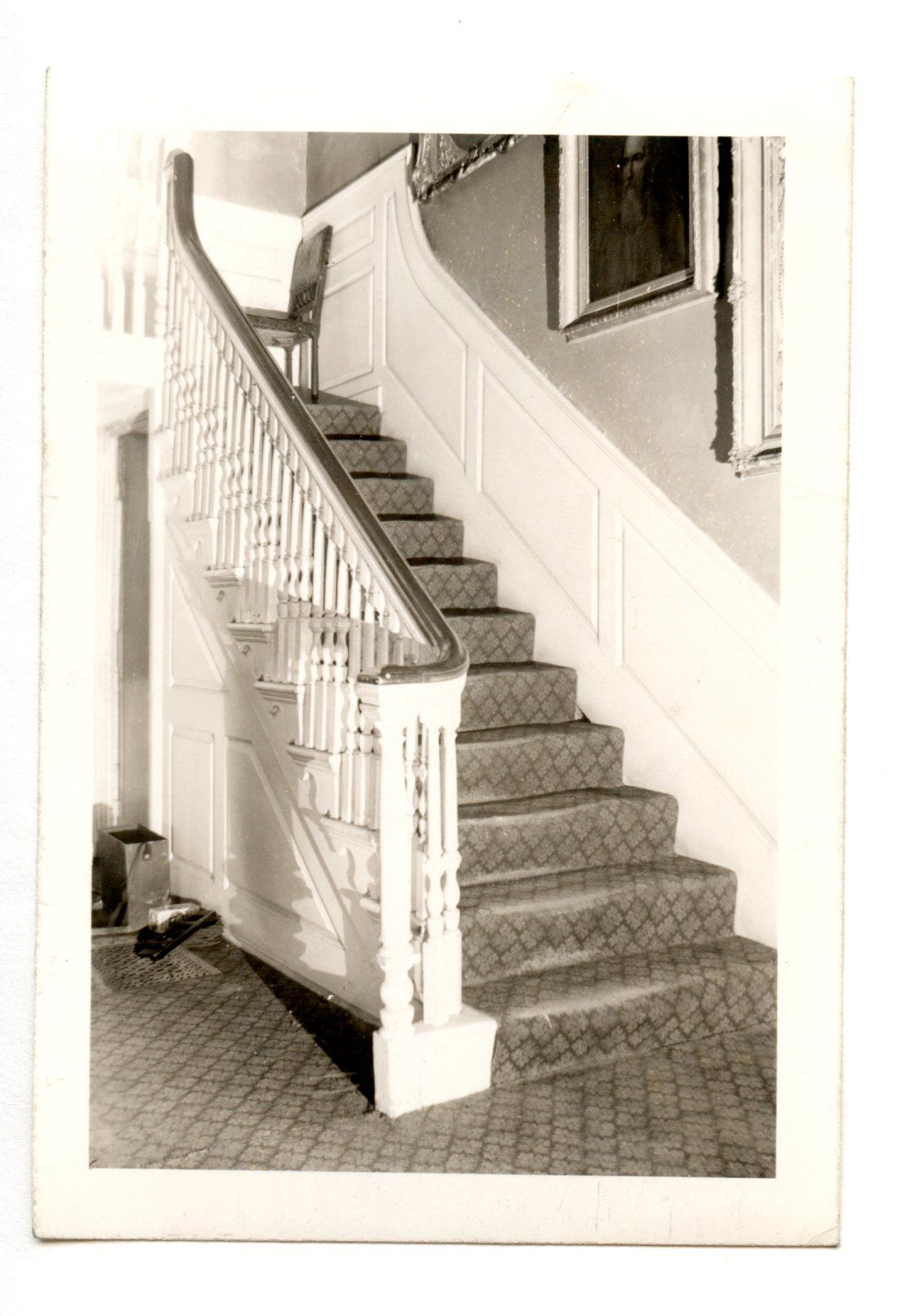 A domestic rear staircase with carpeted treads at Longfellow House