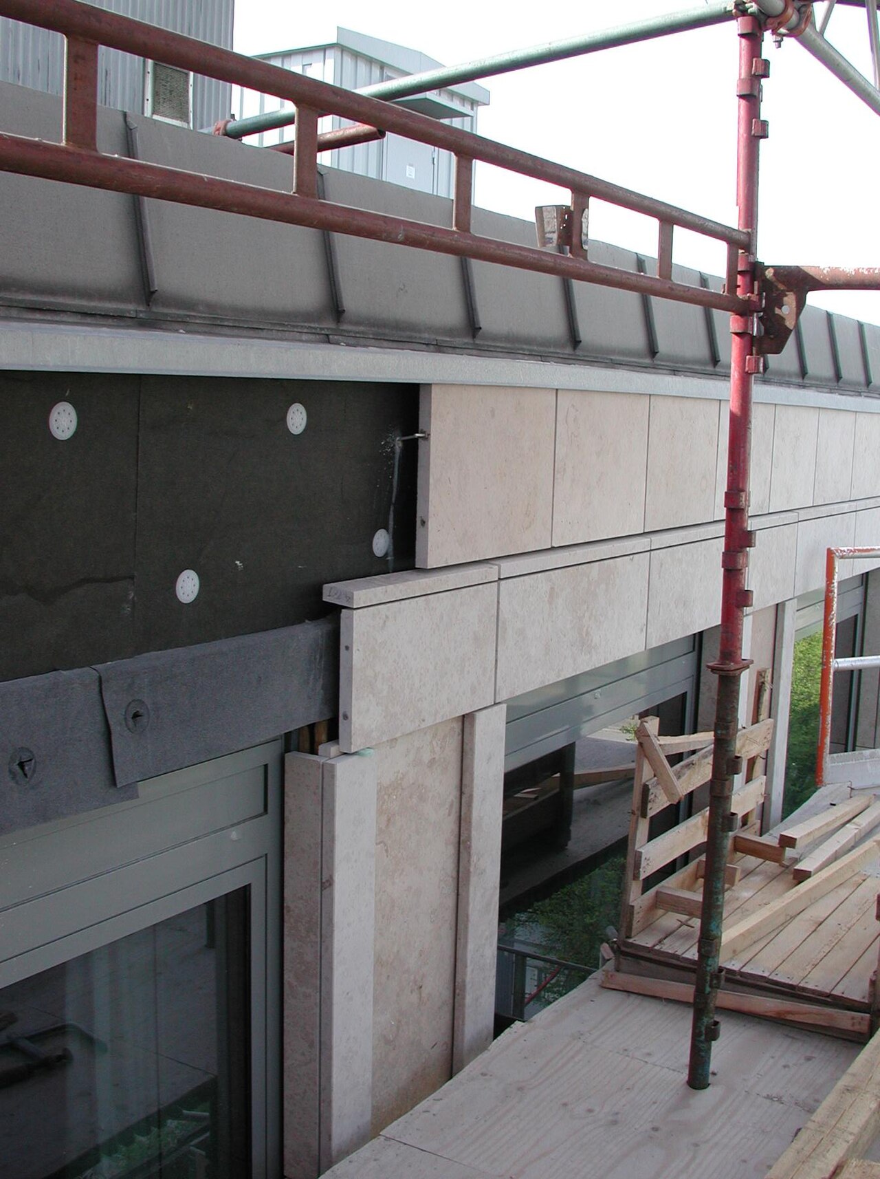 Installation of Jura limestone panels on a ventilated facade subframe
