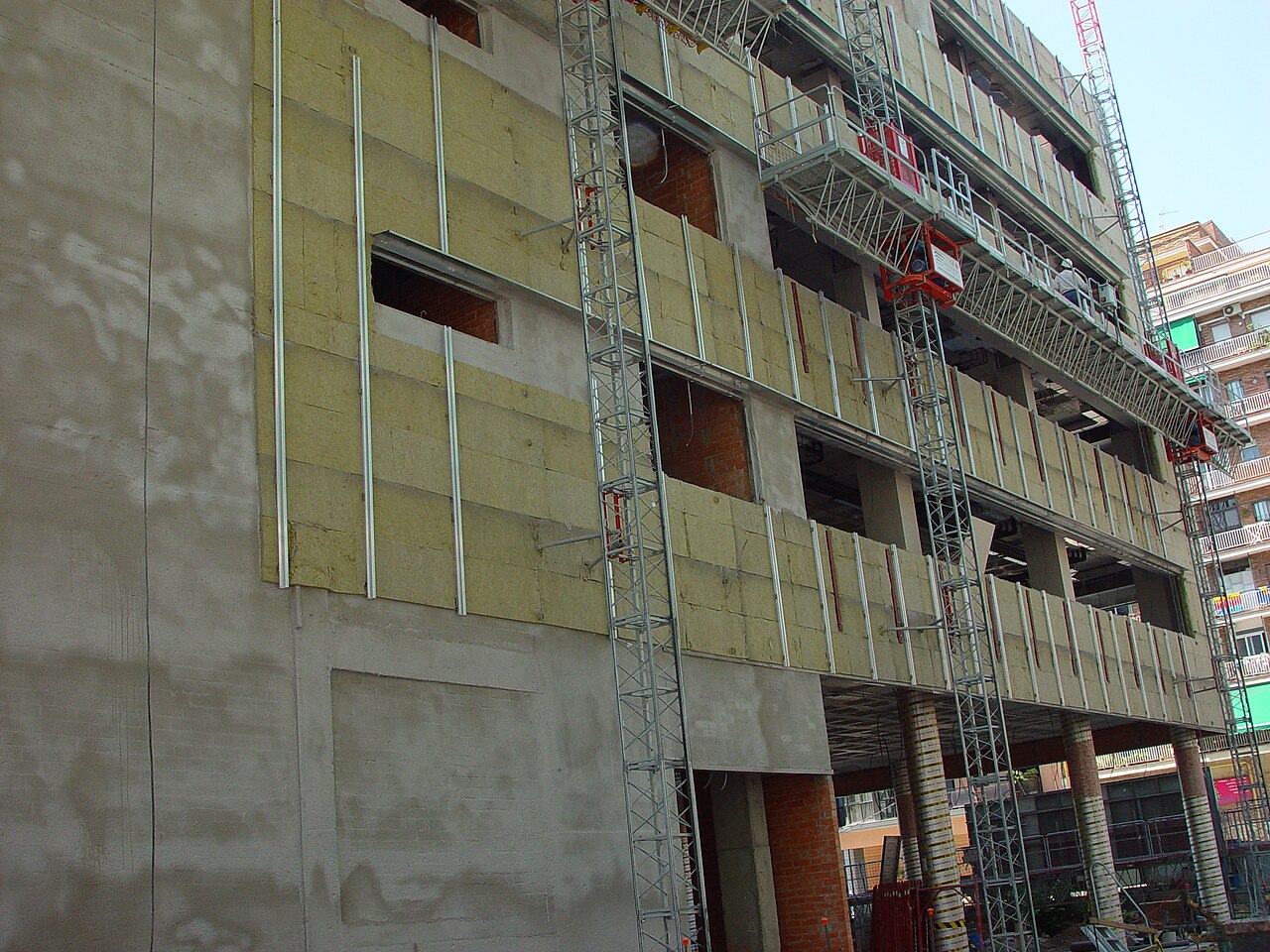 Stone wool insulation installed behind the subframe of a ventilated facade