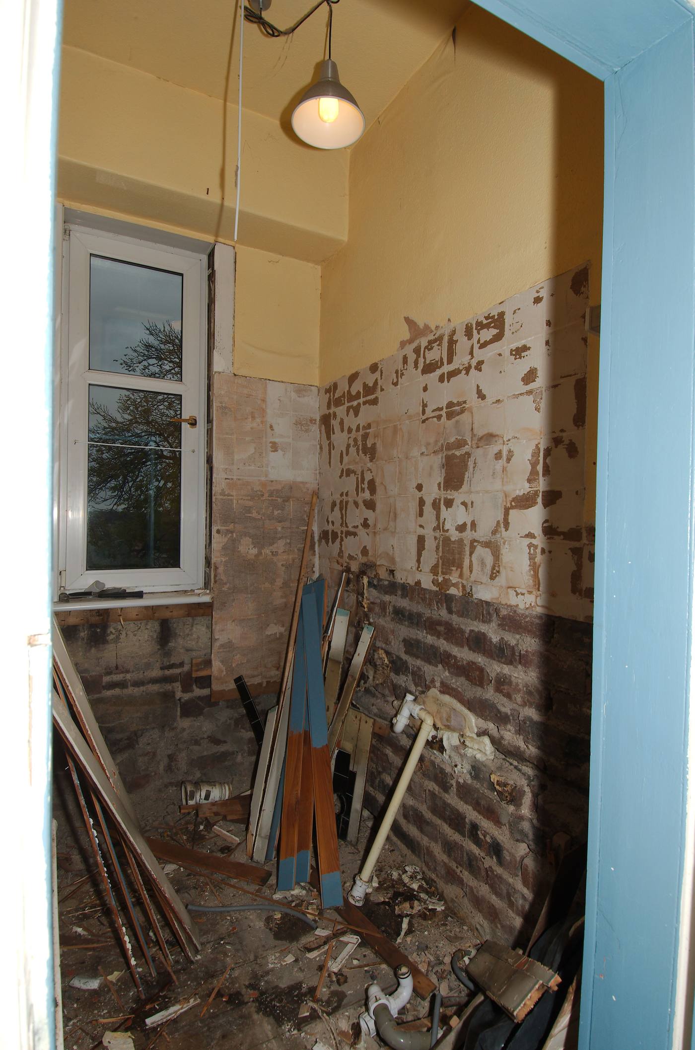 A bathroom mid-renovation — the moment when tanking, falls and ducting are decided, before finishes hide them