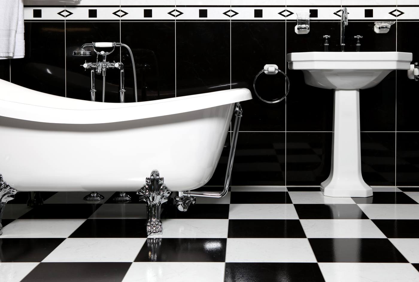 A bathroom planned around a bath — the longest wall, and the largest single footprint, given to one fixture