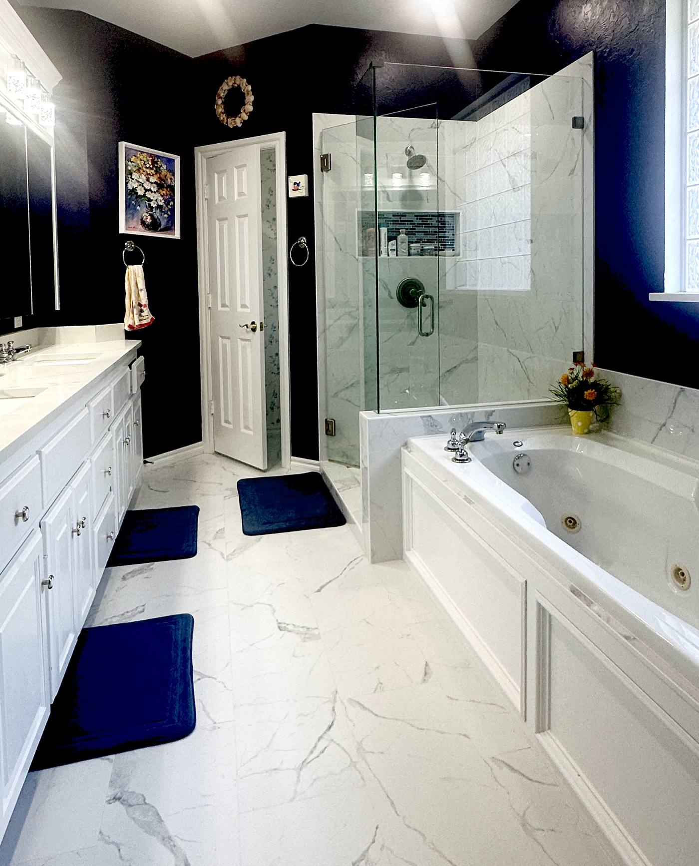 A contemporary bathroom in a one-wall arrangement — every fixture on a single line