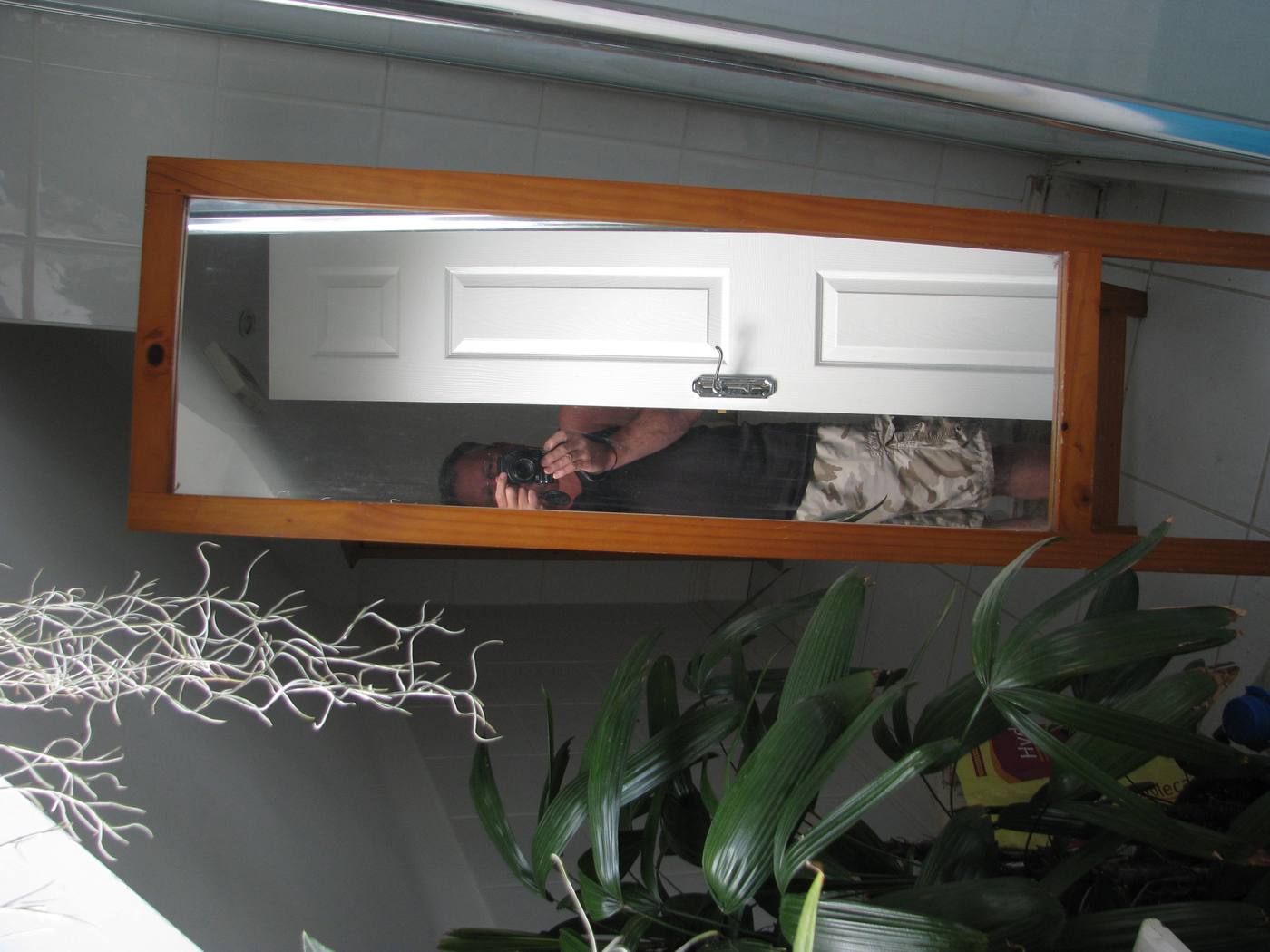 A finished bathroom interior — calm because the plan, the storage and the door were resolved before the finishes