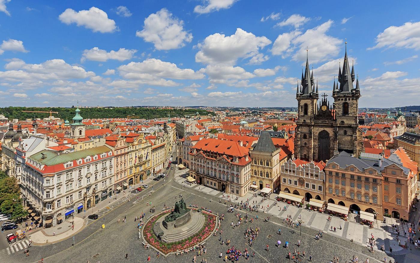 View over the historic rooftops and towers of Prague Old Town, a heritage context for facade decisions