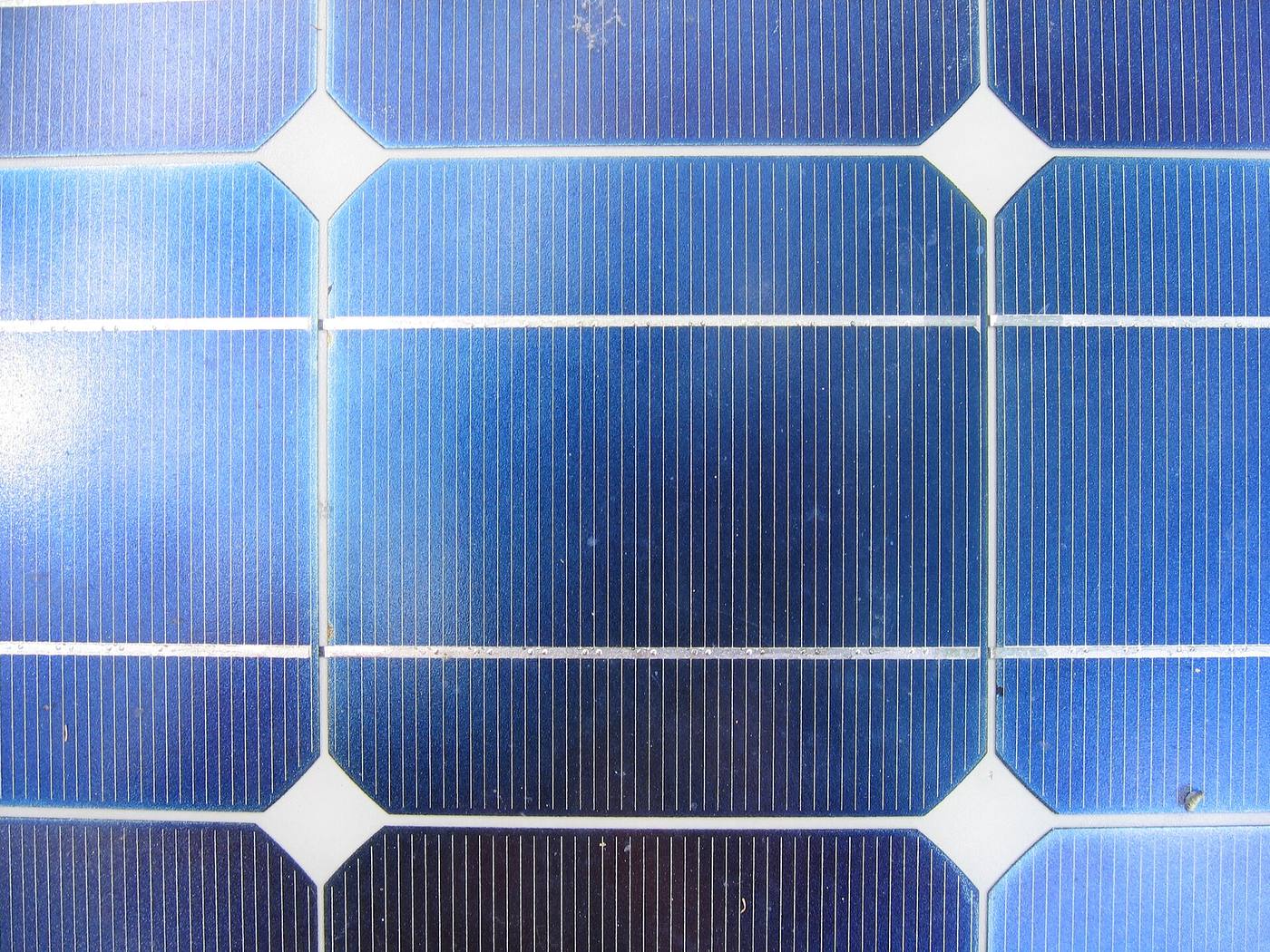 Close-up of photovoltaic cells and their grid connections on a solar module