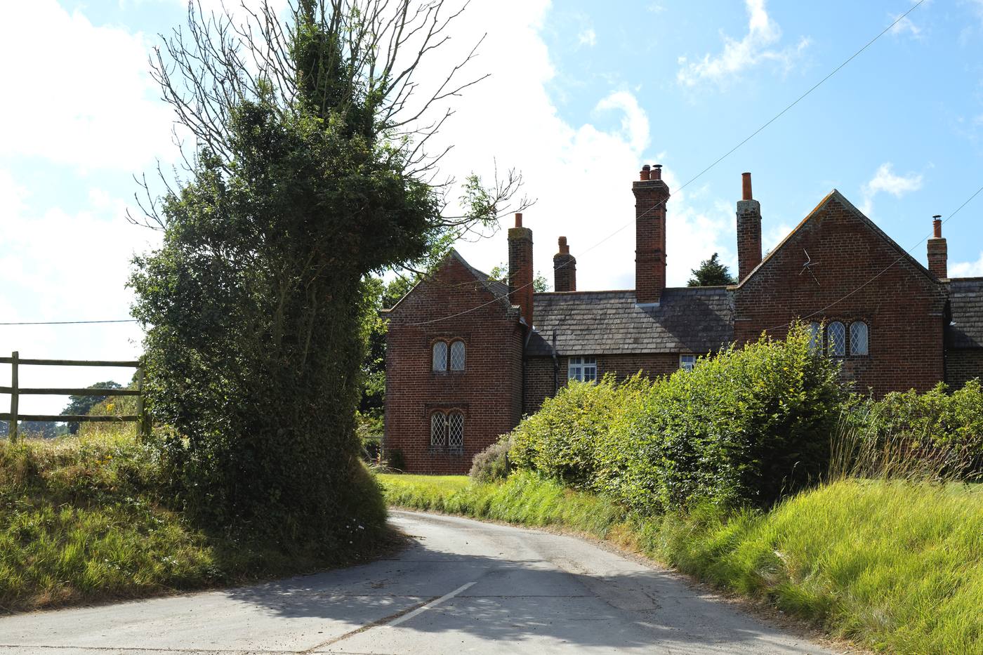 Brick gabled building converted into residential units on Station Road in Chillenden, Kent