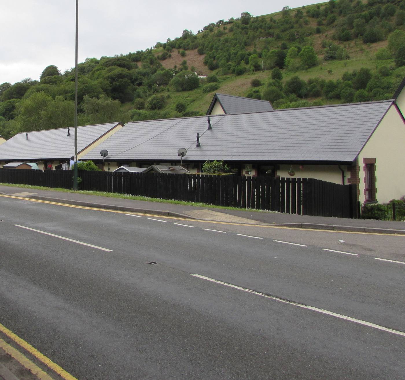 Low-pitched roofs of new houses at Rhosyn Gwyn, New Tredegar, Wales