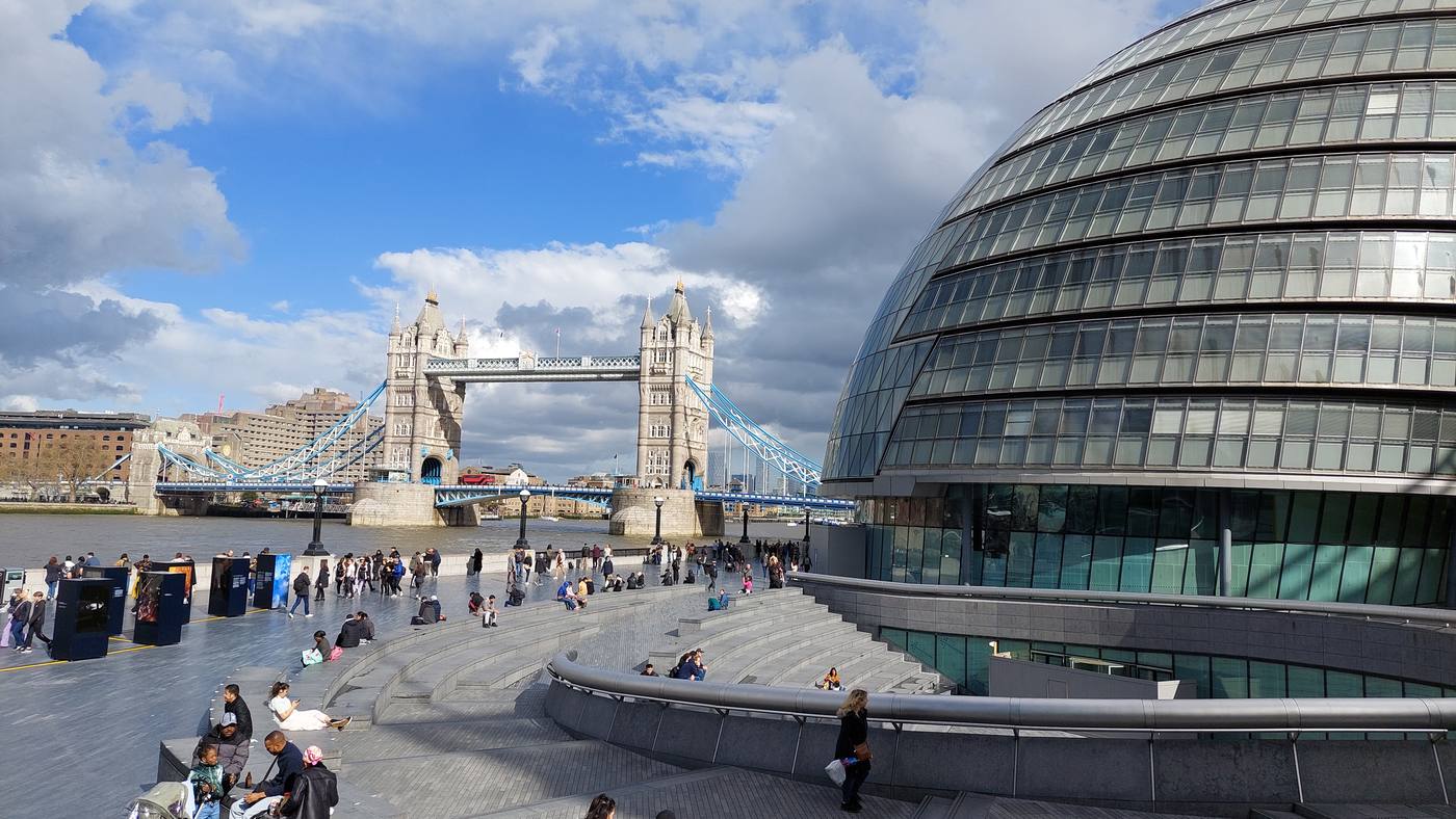 The former City Hall, London, with Tower Bridge behind it on the Thames