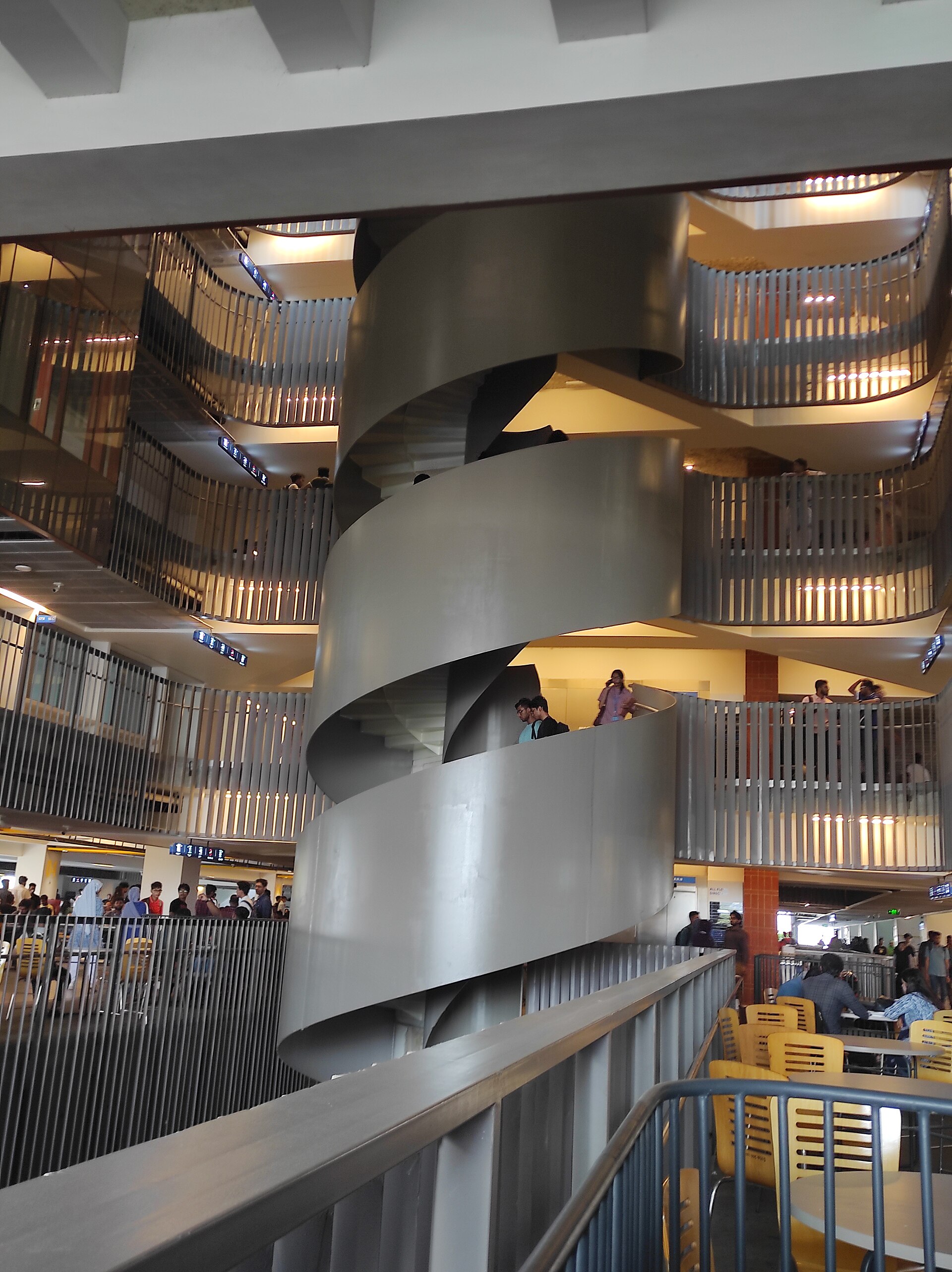 Interior atrium and stair of BRAC University campus in Dhaka photographed in 2024