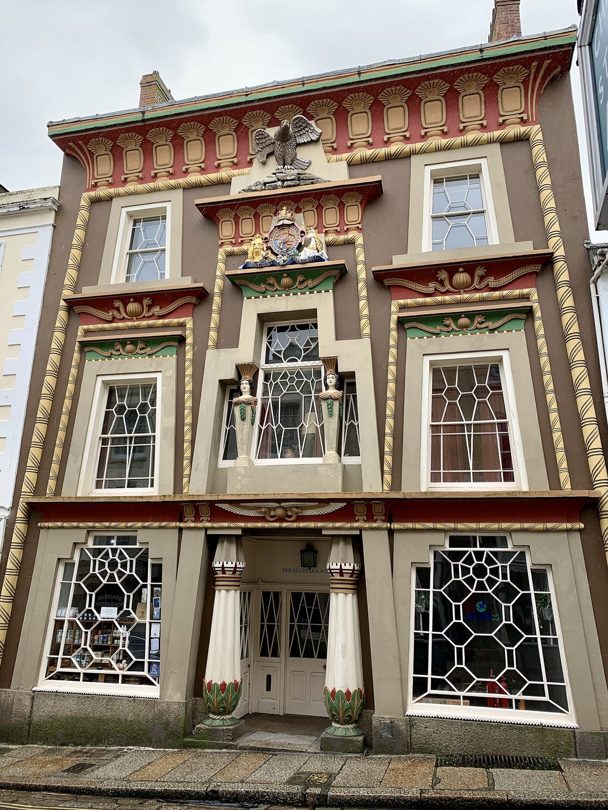 The Egyptian House in Penzance, Cornwall (c. 1835): a stucco facade of lotus columns, a winged disc and pharaonic figures in the Egyptian Revival taste