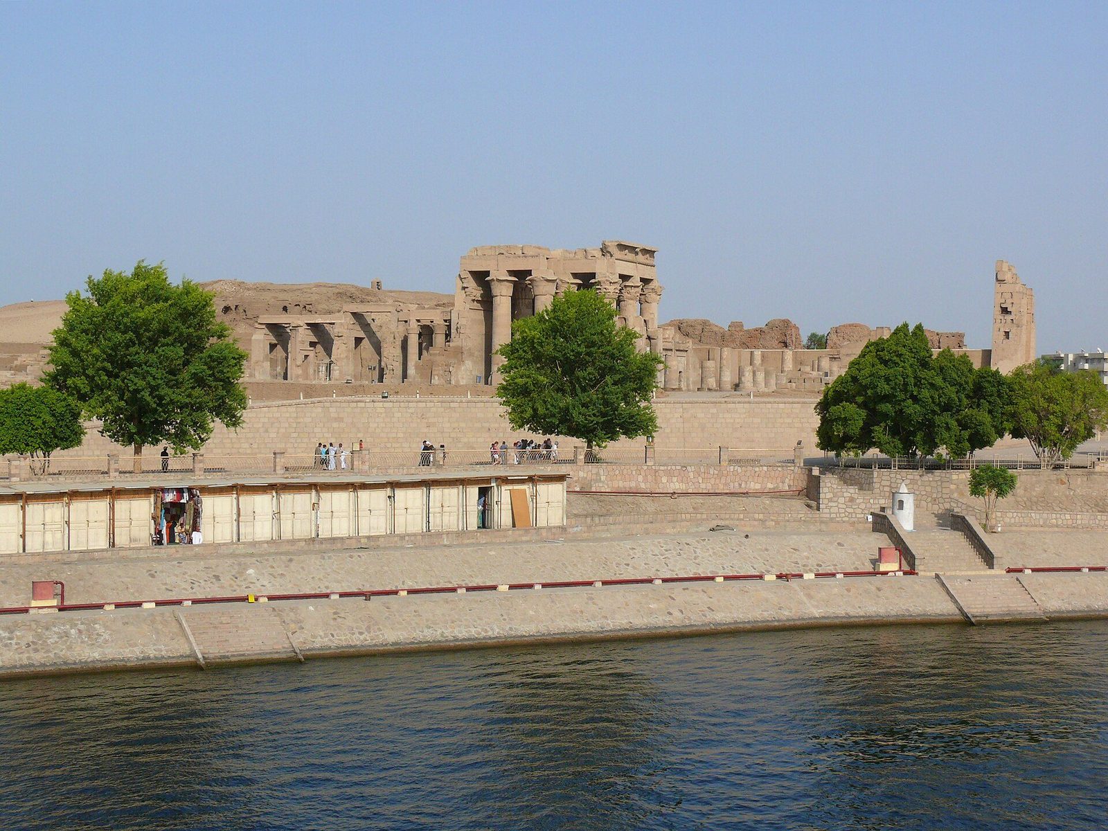 The Temple of Kom Ombo from the Nile: the double temple standing on its platform above the riverbank