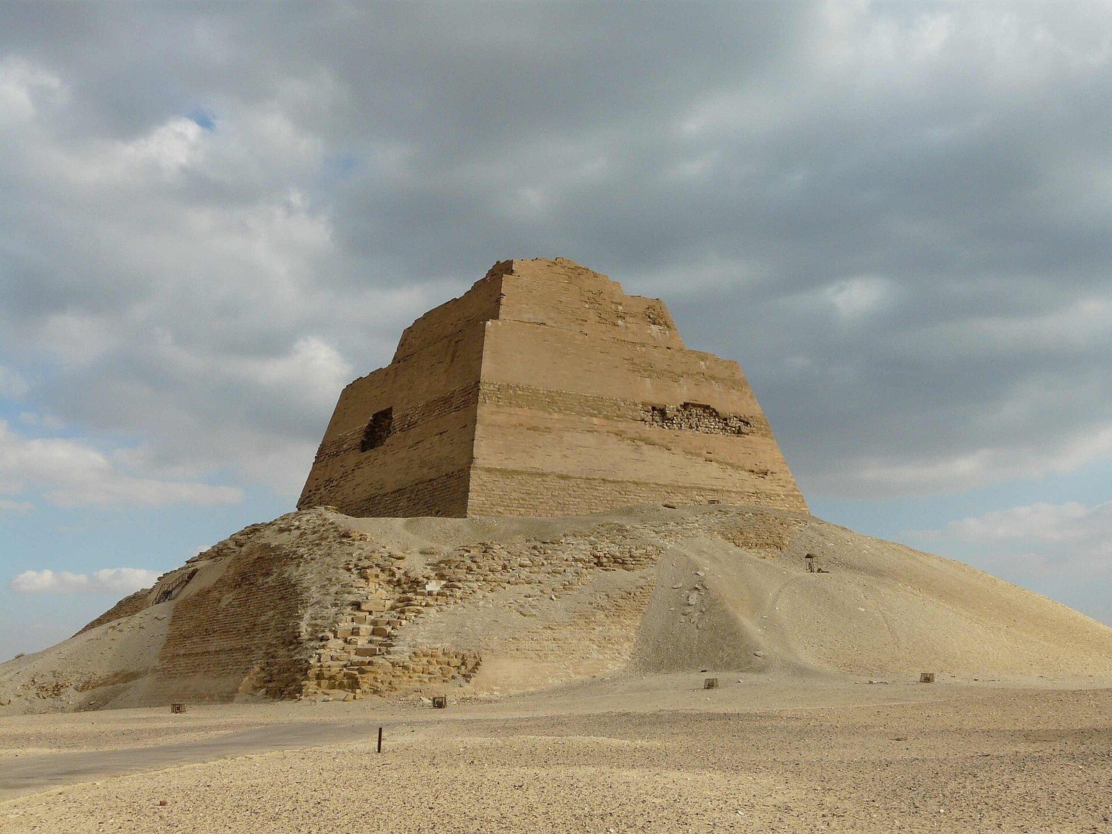 The pyramid of Meidum: the stepped core tower rising from its mound of collapsed casing and sand