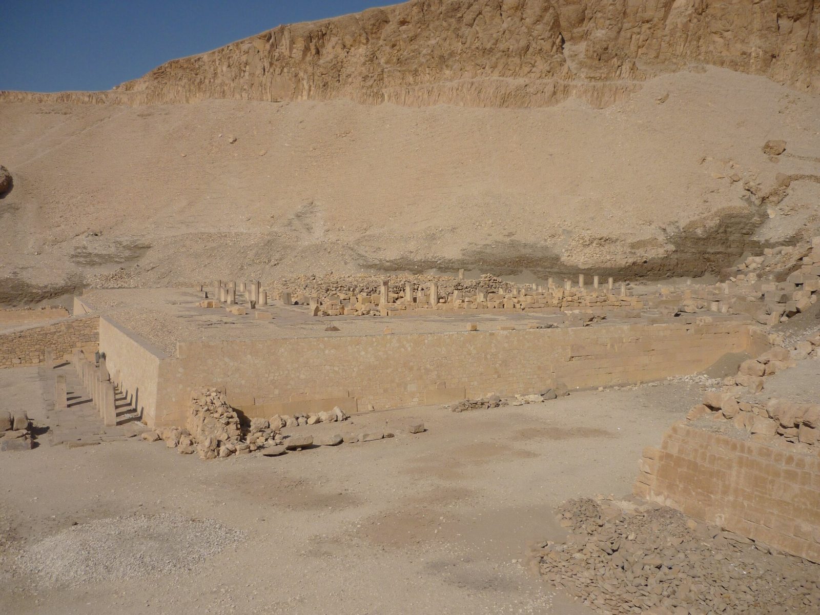 The terraced podium of Mentuhotep II's mortuary temple at Deir el-Bahari: the low stone platform from which its colonnades once rose