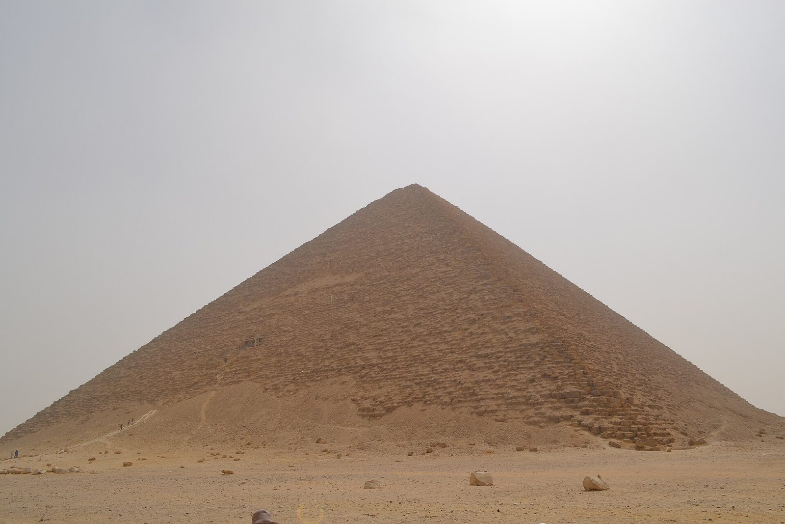 The Red Pyramid of Sneferu at Dahshur: the first successful true pyramid, its red limestone core exposed by the loss of its casing