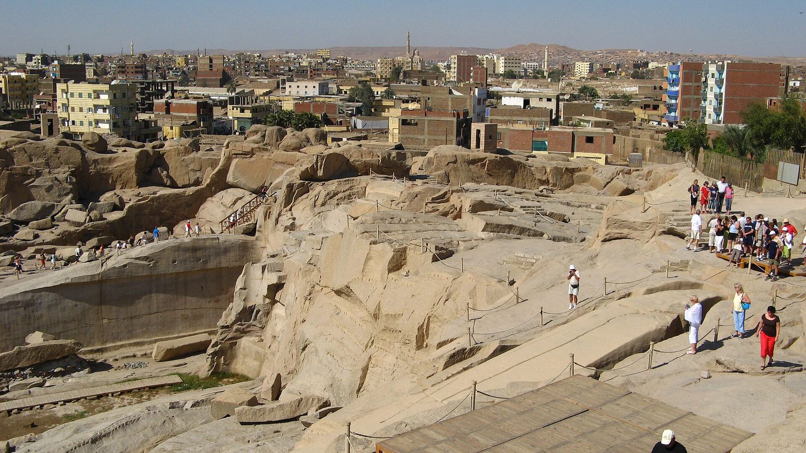 The Aswan granite quarry: the unfinished obelisk still lying in its trench, cracked across before it could be freed from the bedrock