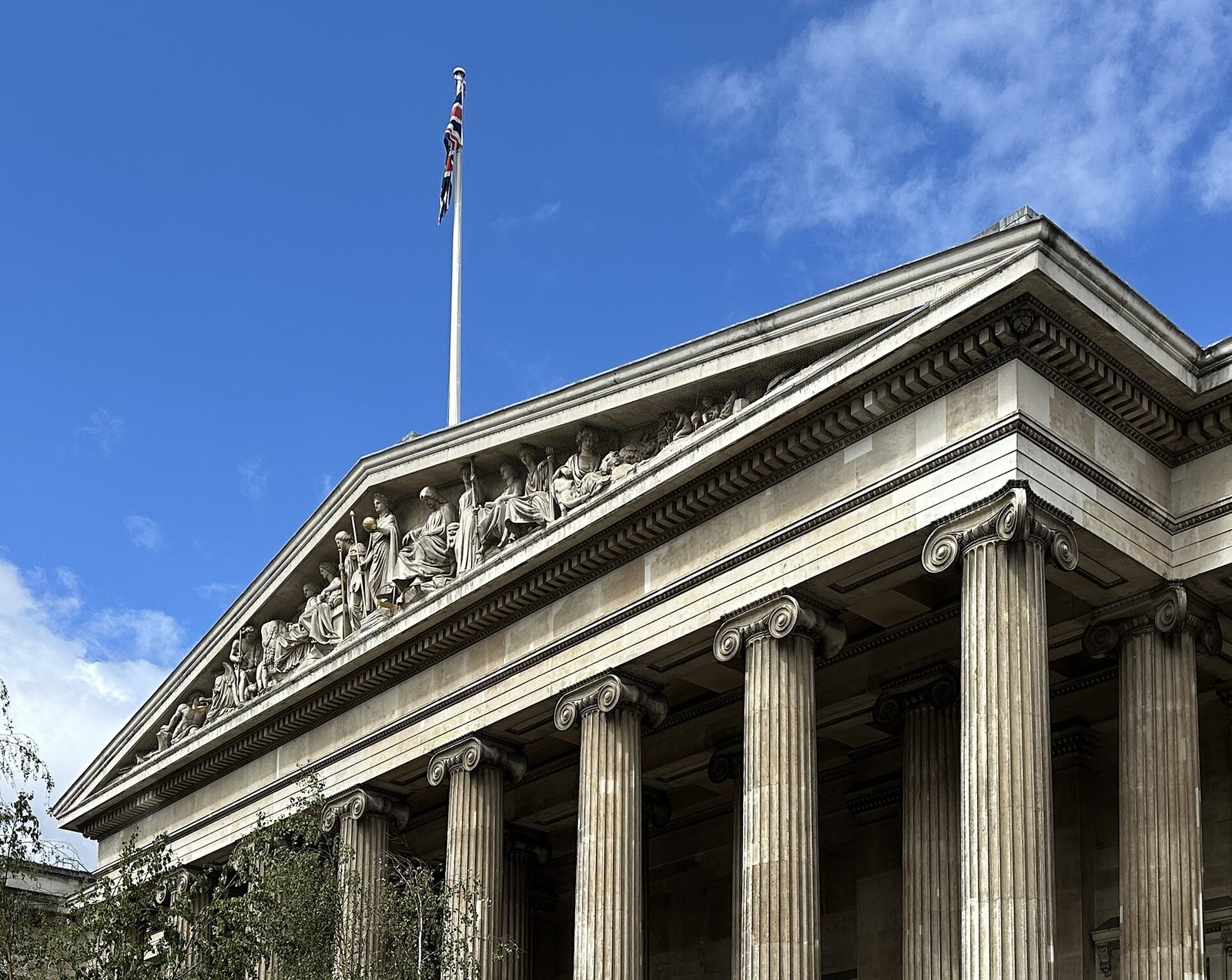 The Ionic portico of the British Museum in London: fluted columns and pediment sculpture
