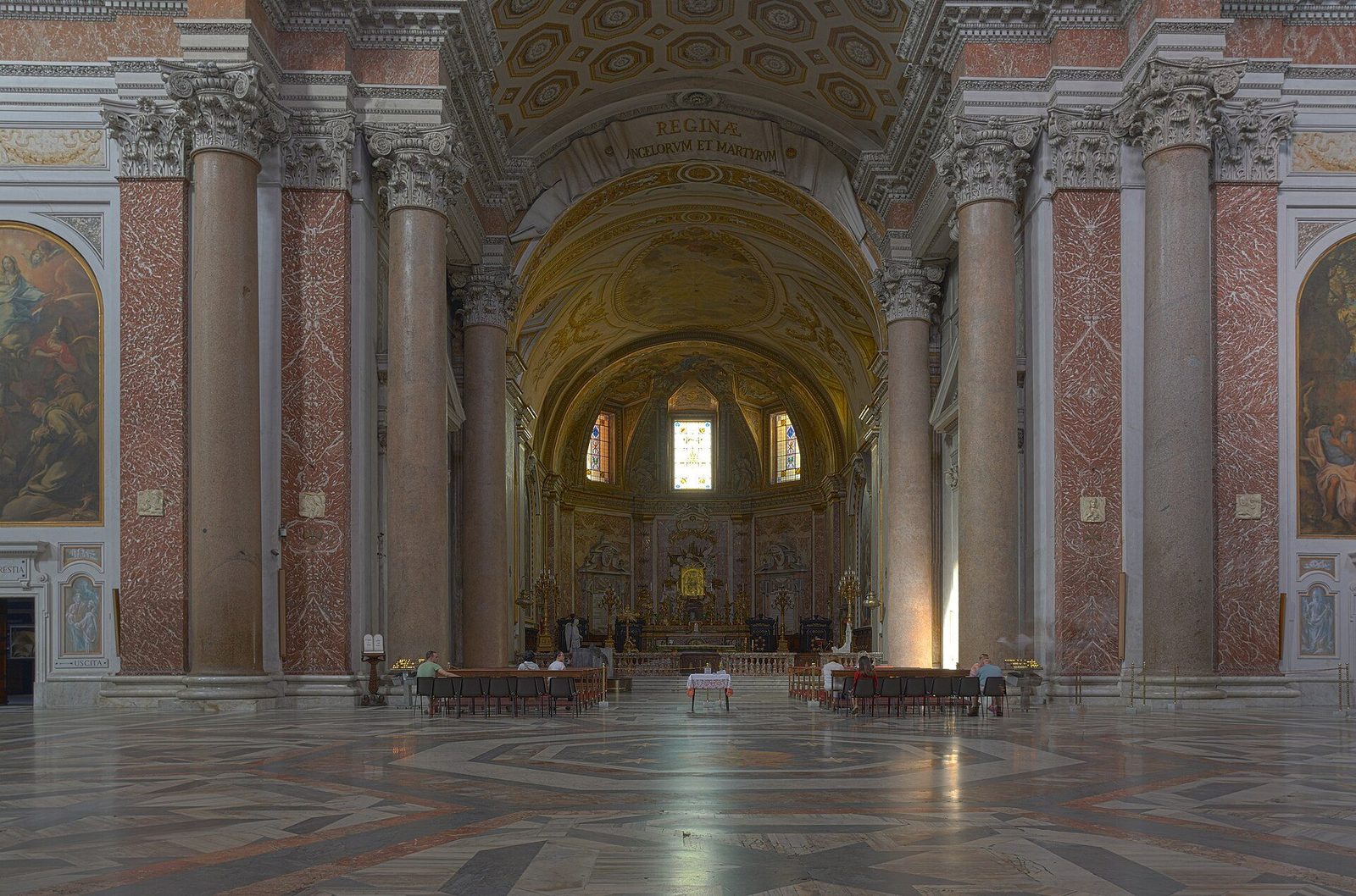 The church of Santa Maria degli Angeli inside the Baths of Diocletian in Rome: the vast cross-vaulted frigidarium hall with its pink granite columns