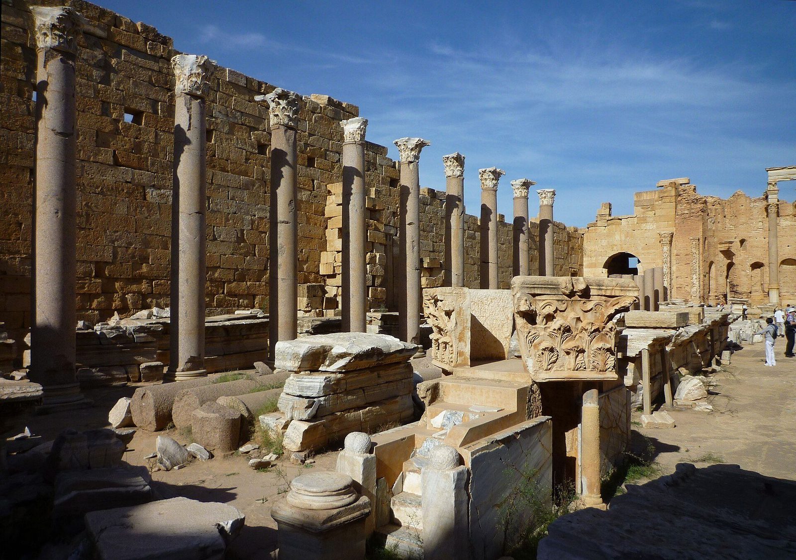 The Severan Basilica at Leptis Magna in Libya: rows of standing columns and carved stone piers along the great aisled hall