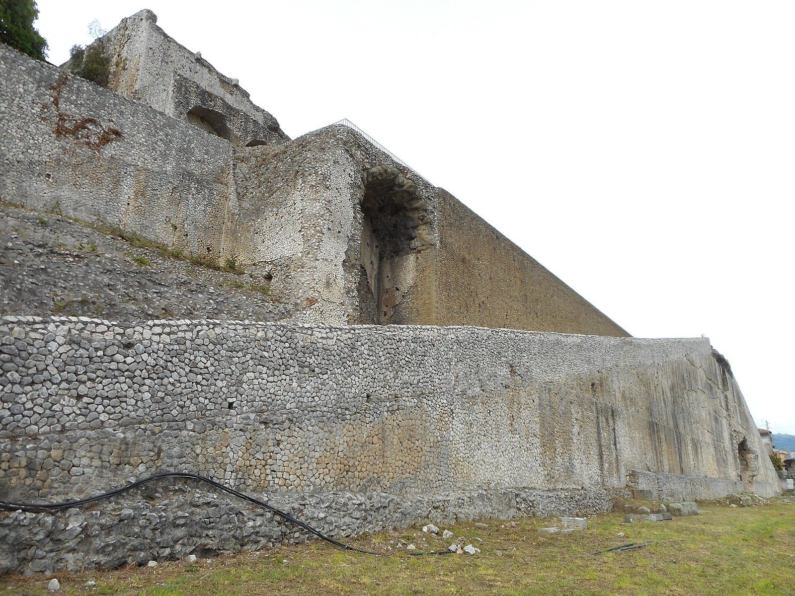 One of the great concrete ramps of the Sanctuary of Fortuna Primigenia at Palestrina (ancient Praeneste): a massive sloped terrace wall of Roman concrete