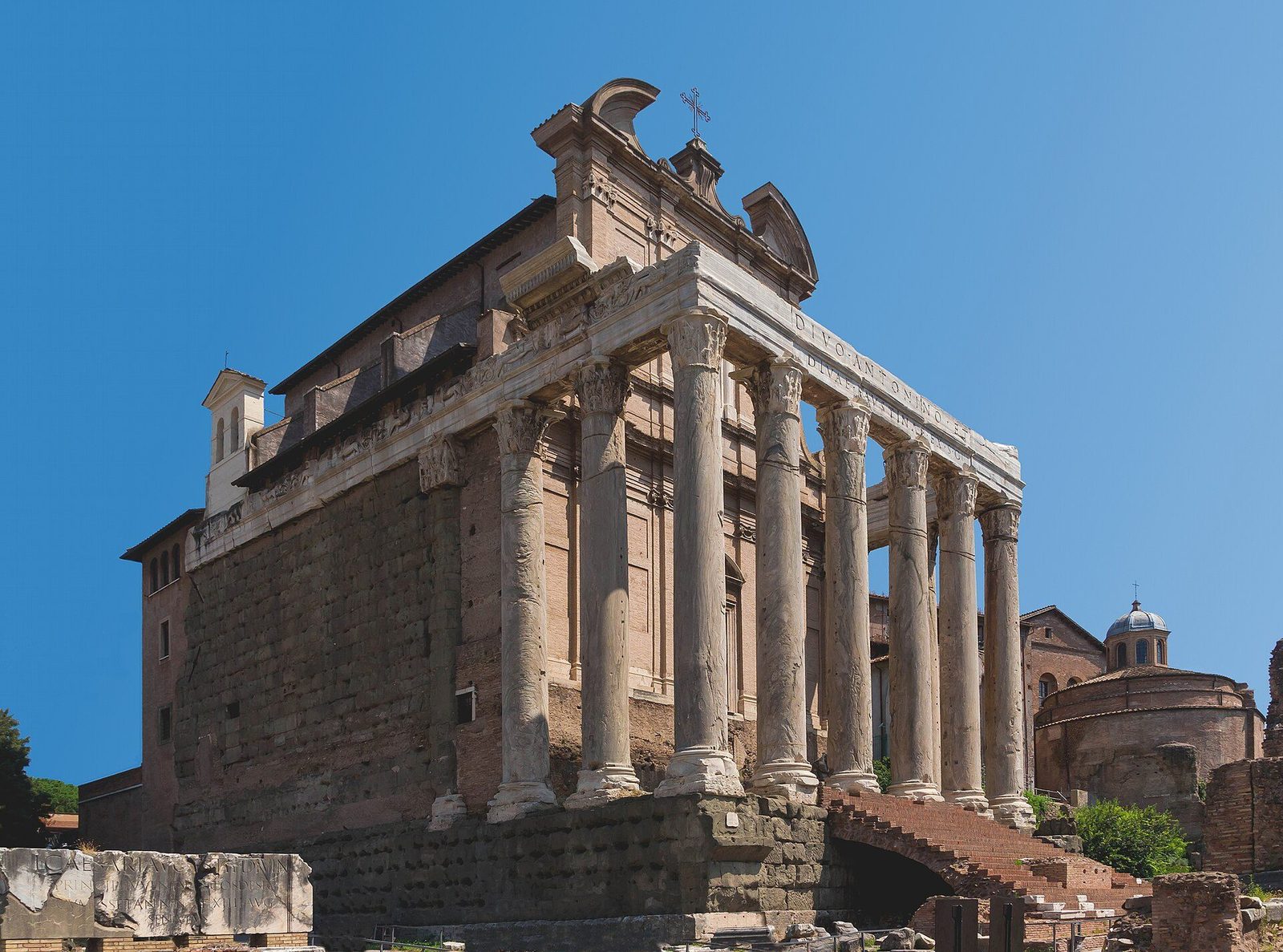 The Temple of Antoninus and Faustina in the Roman Forum: its tall columned portico, with the church of San Lorenzo in Miranda built into the cella behind