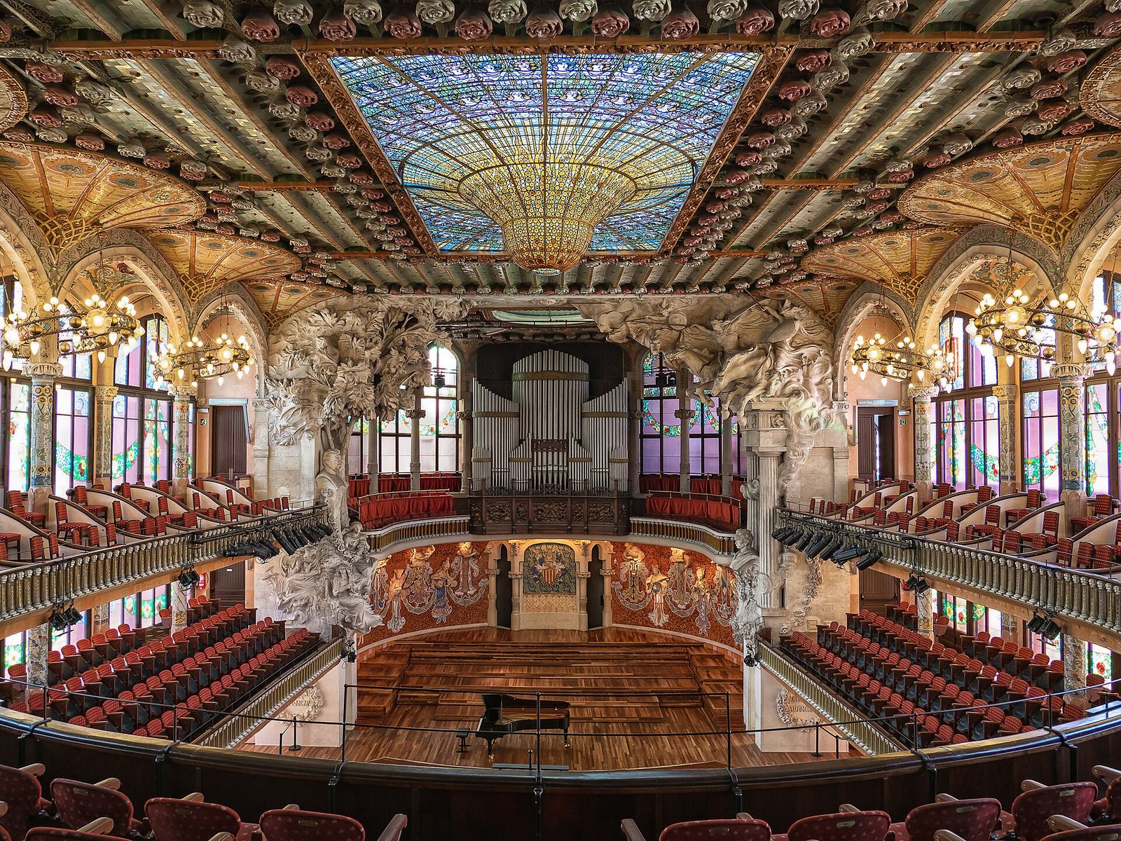 The concert hall of the Palau de la Música Catalana in Barcelona, its stained-glass skylight above the stage