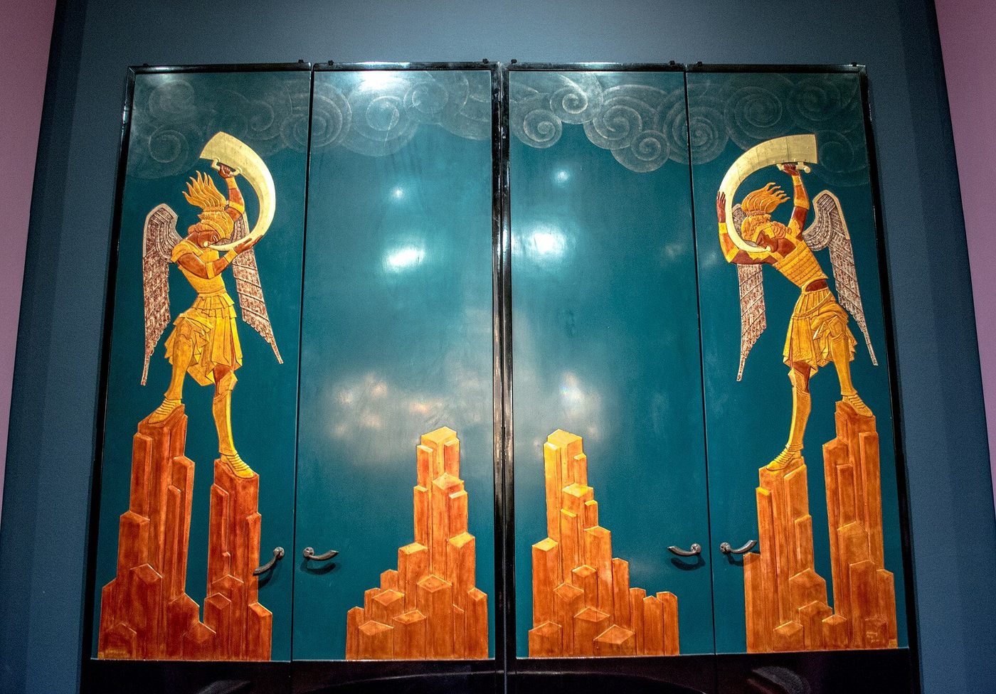 Lacquered doors by Jean Dunand and Séraphin Soudbinine with gilded winged figures on teal grounds
