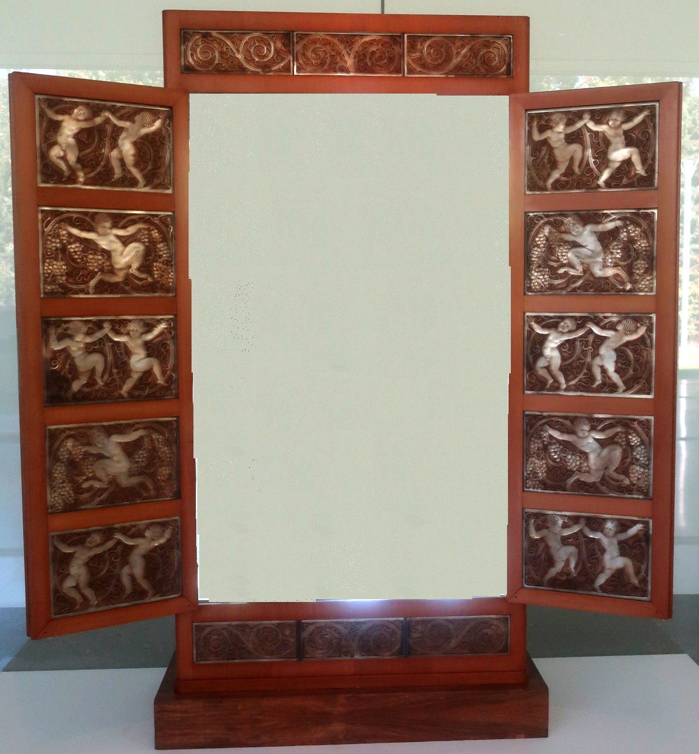 A Lalique cabinet with moulded-glass panels of fauns and cherubs