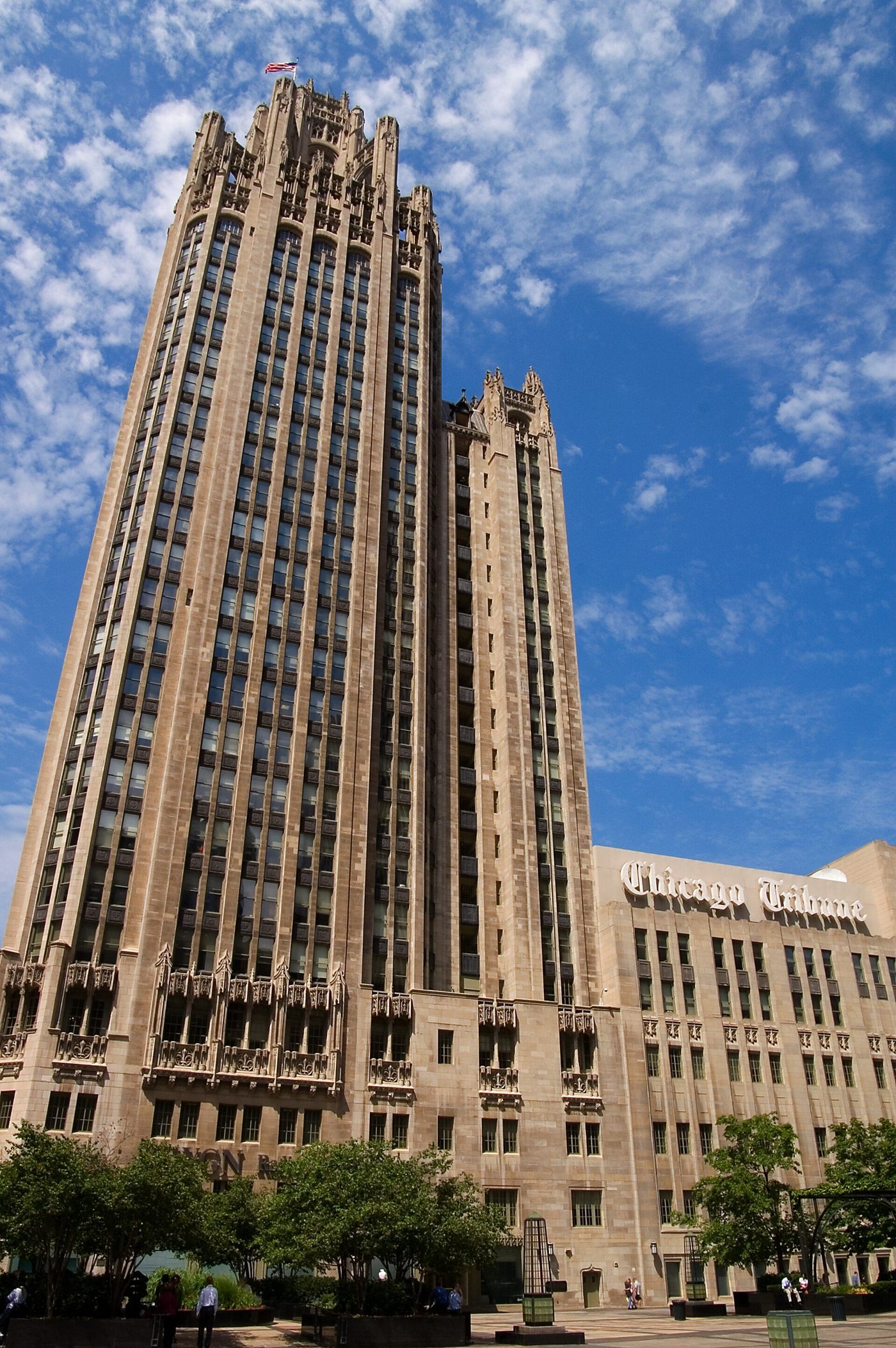 The Chicago Tribune Tower seen from below against a blue sky