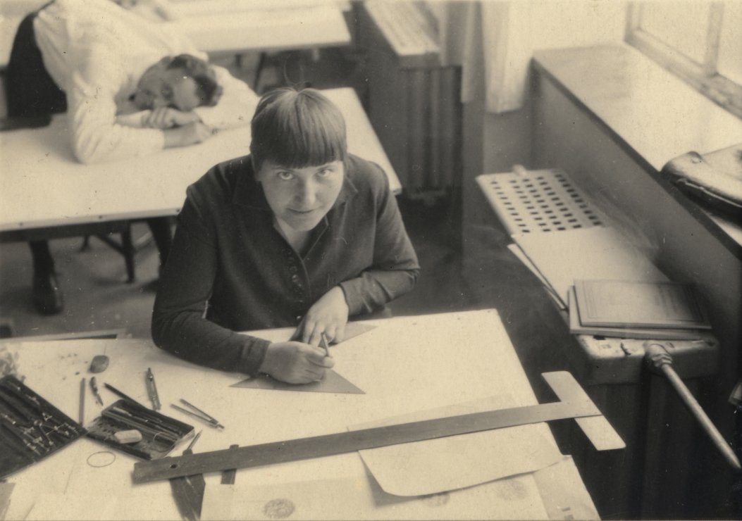 Bauhaus students at work in a workshop, with tools and materials
