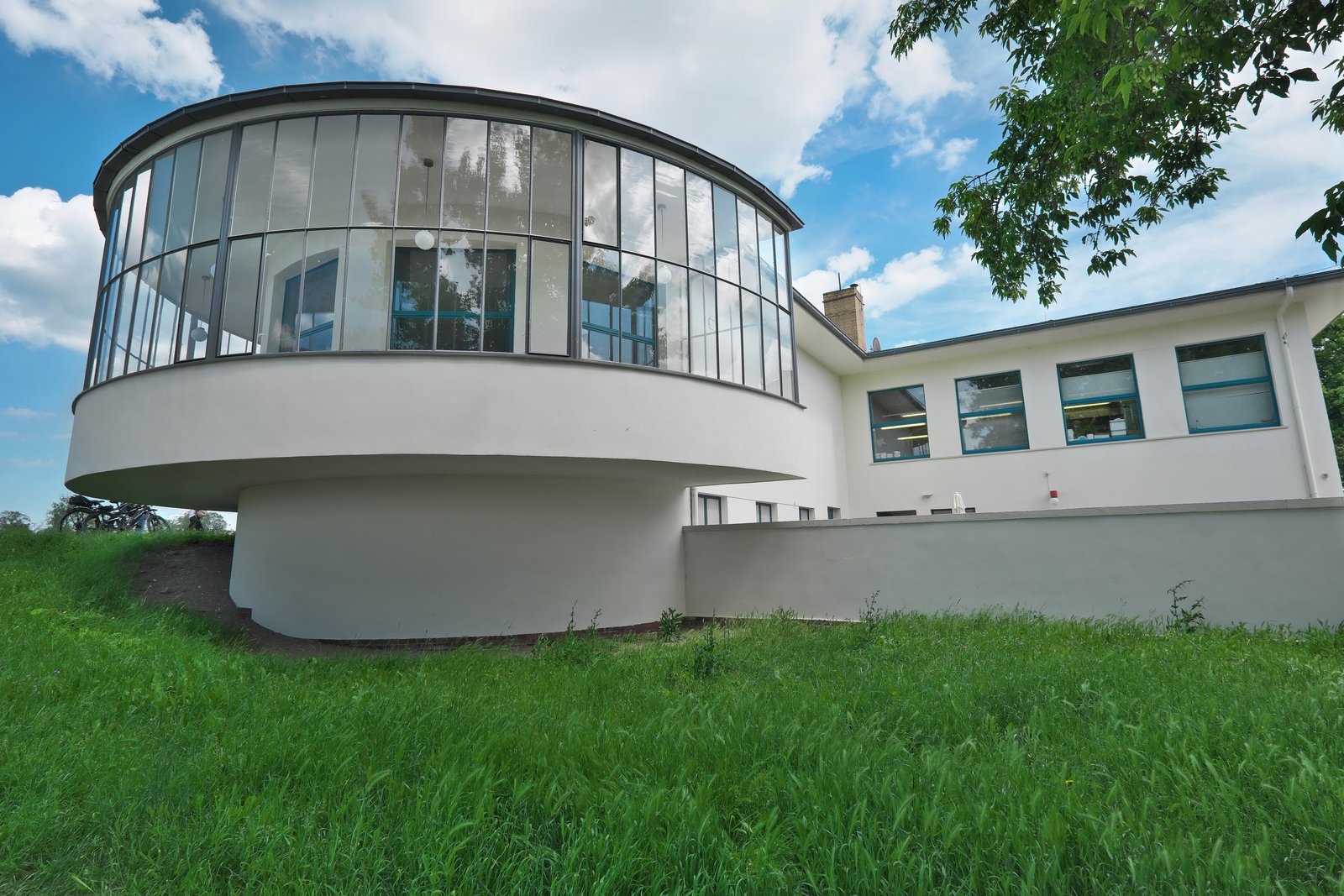 The Kornhaus restaurant in Dessau, its curved glass dining room over the Elbe