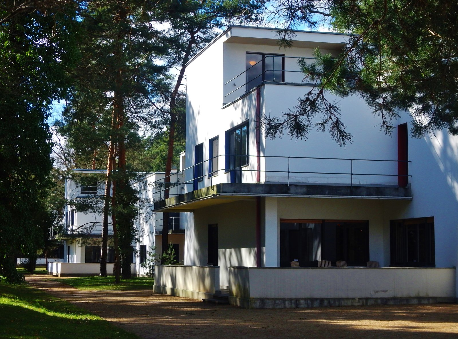The Masters' Houses in Dessau, white cubic houses among pine trees