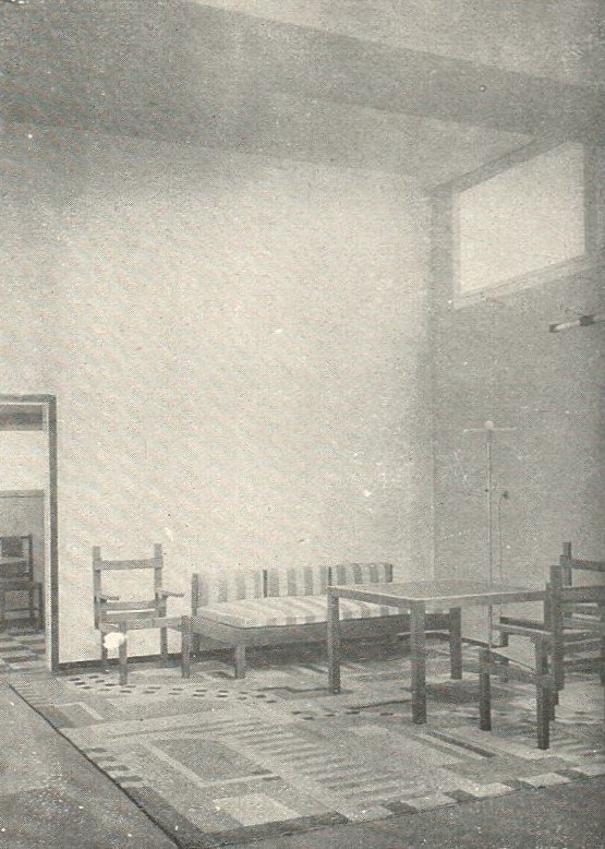 An open-plan interior with flowing rooms and built-in furniture