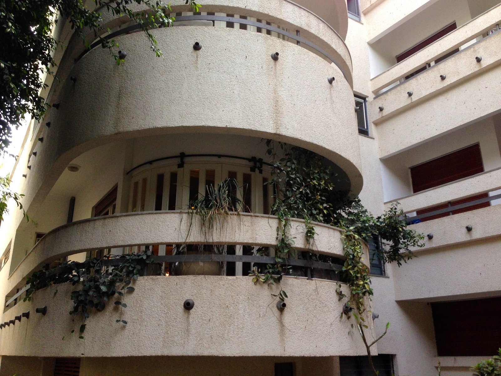 White City apartment buildings in Tel Aviv, white modernist blocks with strip windows and balconies