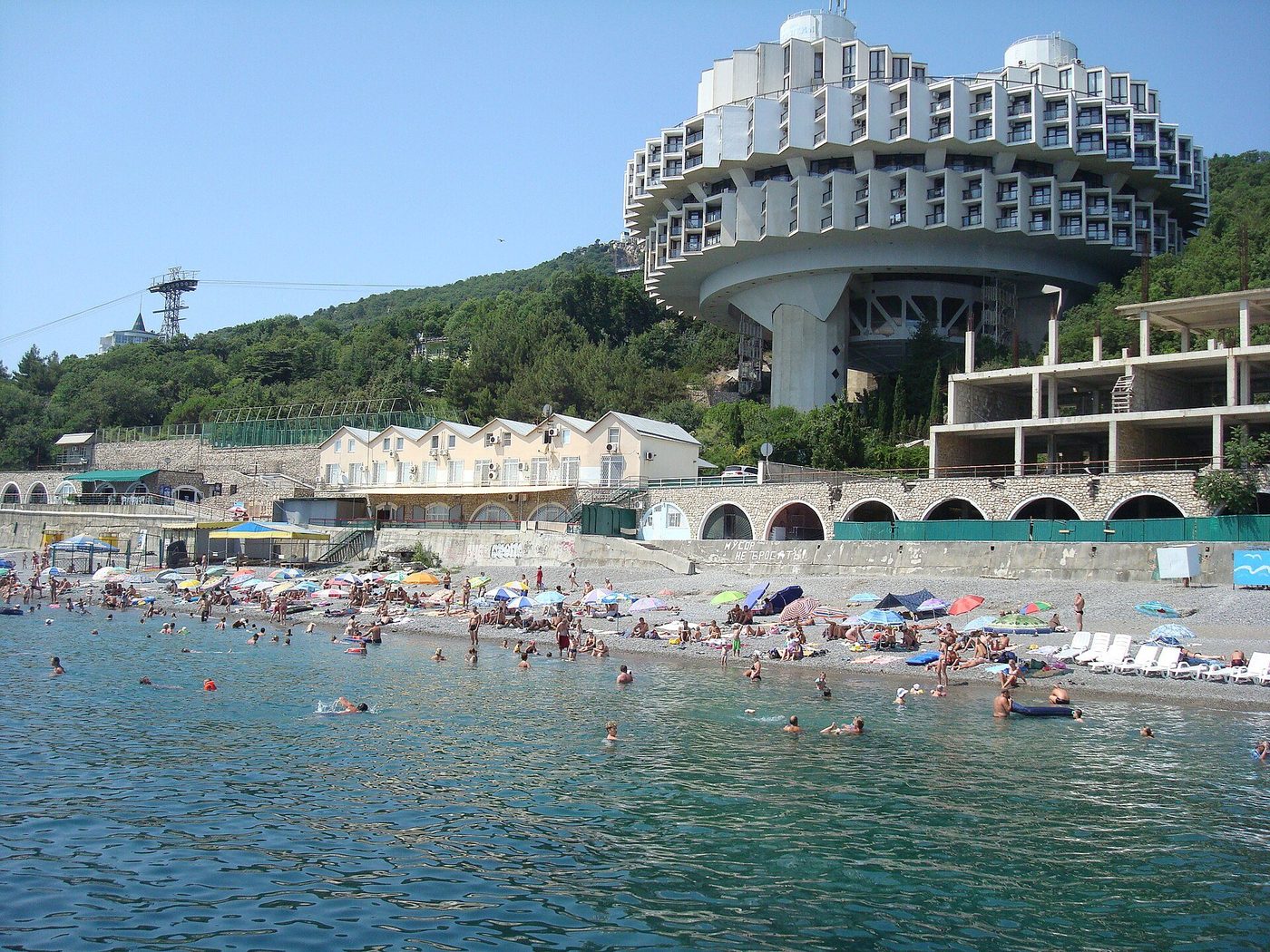 The Druzhba Sanatorium at Kurpaty, Yalta — a ring of balconies carried on three towers above the beach
