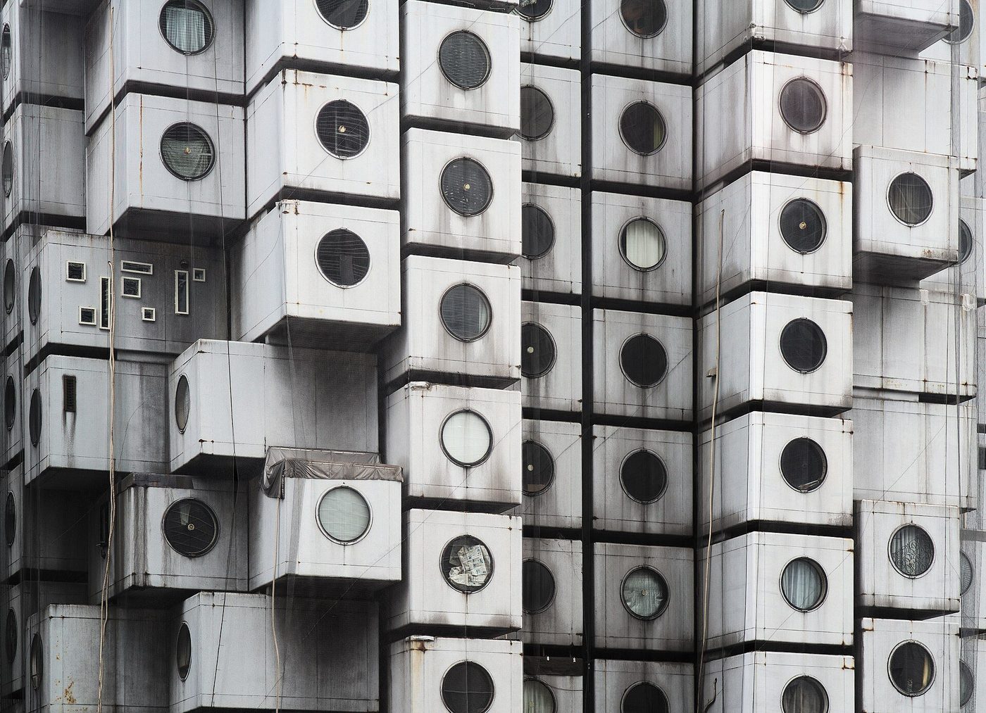 The Nakagin Capsule Tower, Tokyo — capsules with their round windows stacked on the service cores
