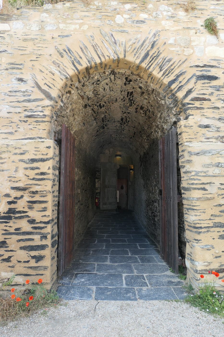 The ramparts of the Château d'Angers: the vast thirteenth-century enceinte of dark schist banded with pale stone