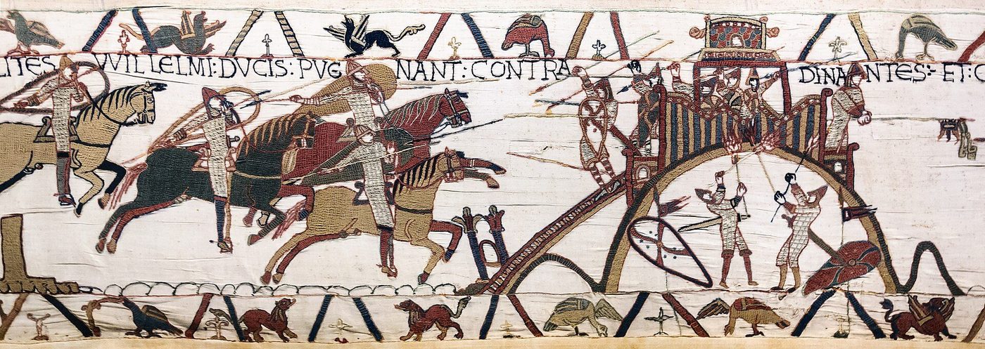 The Bayeux Tapestry: the motte castle at Dinan, its timber tower and palisade on the mound, surrendered to William's army