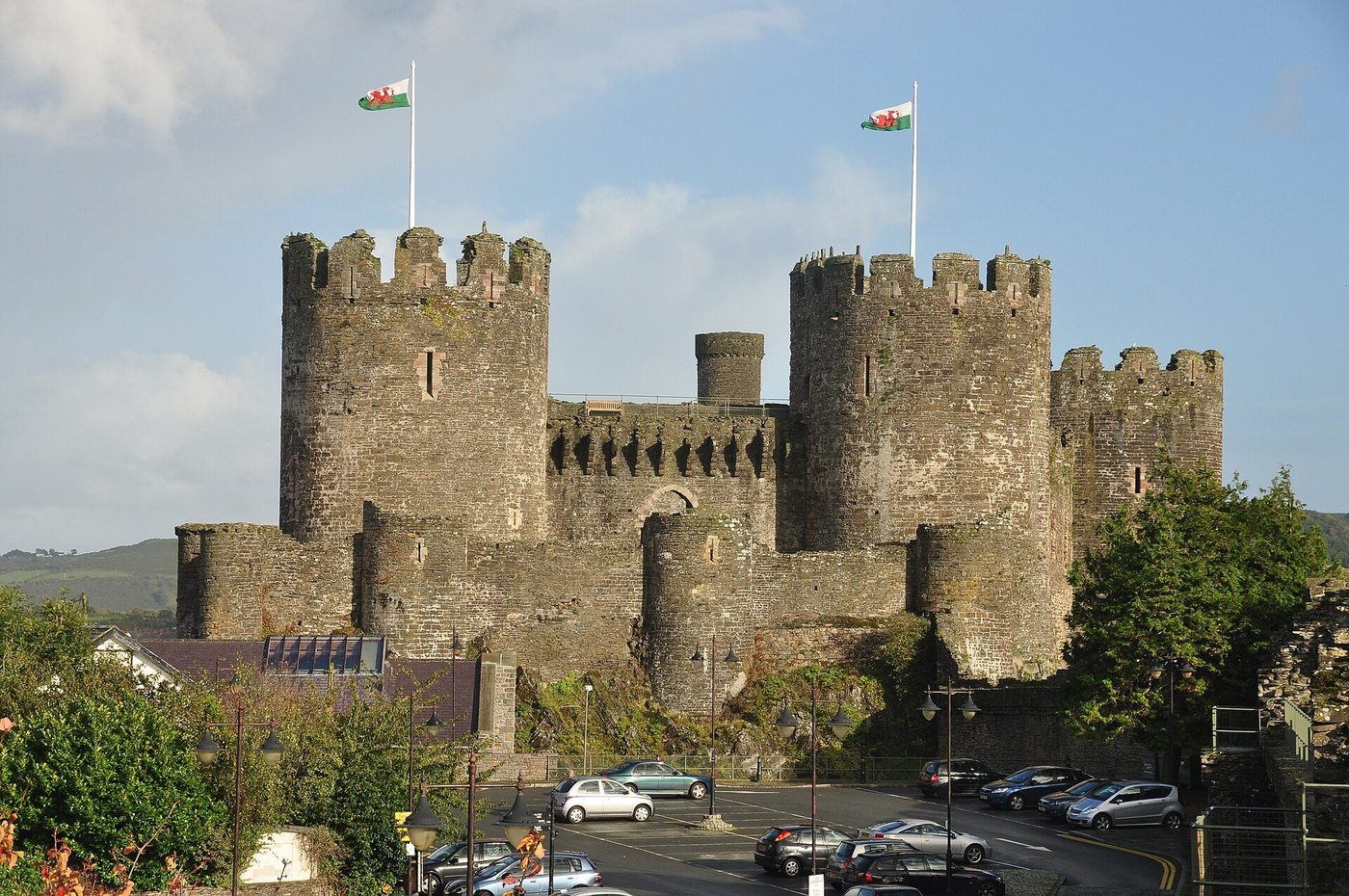 Conwy Castle above its estuary: eight great towers and two wards bent along the rock, the walled town beyond