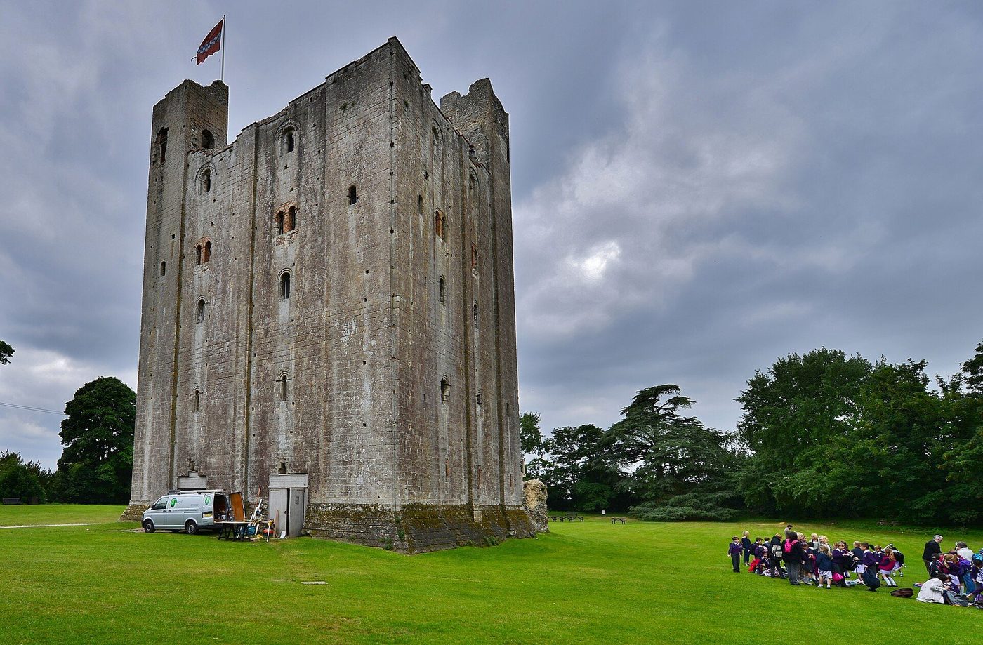 Hedingham Castle keep: the Norman great tower of stone rising above lawns and trees