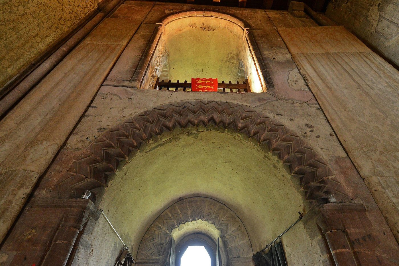 The banqueting hall inside Hedingham keep: a great chamber carried on a Norman round-arched arcade