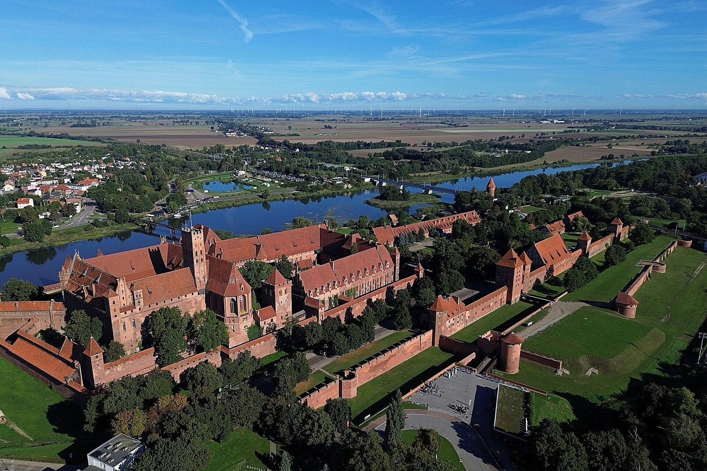 Malbork Castle from the air: the vast brick complex of the Teutonic Order stretched along the Nogat river